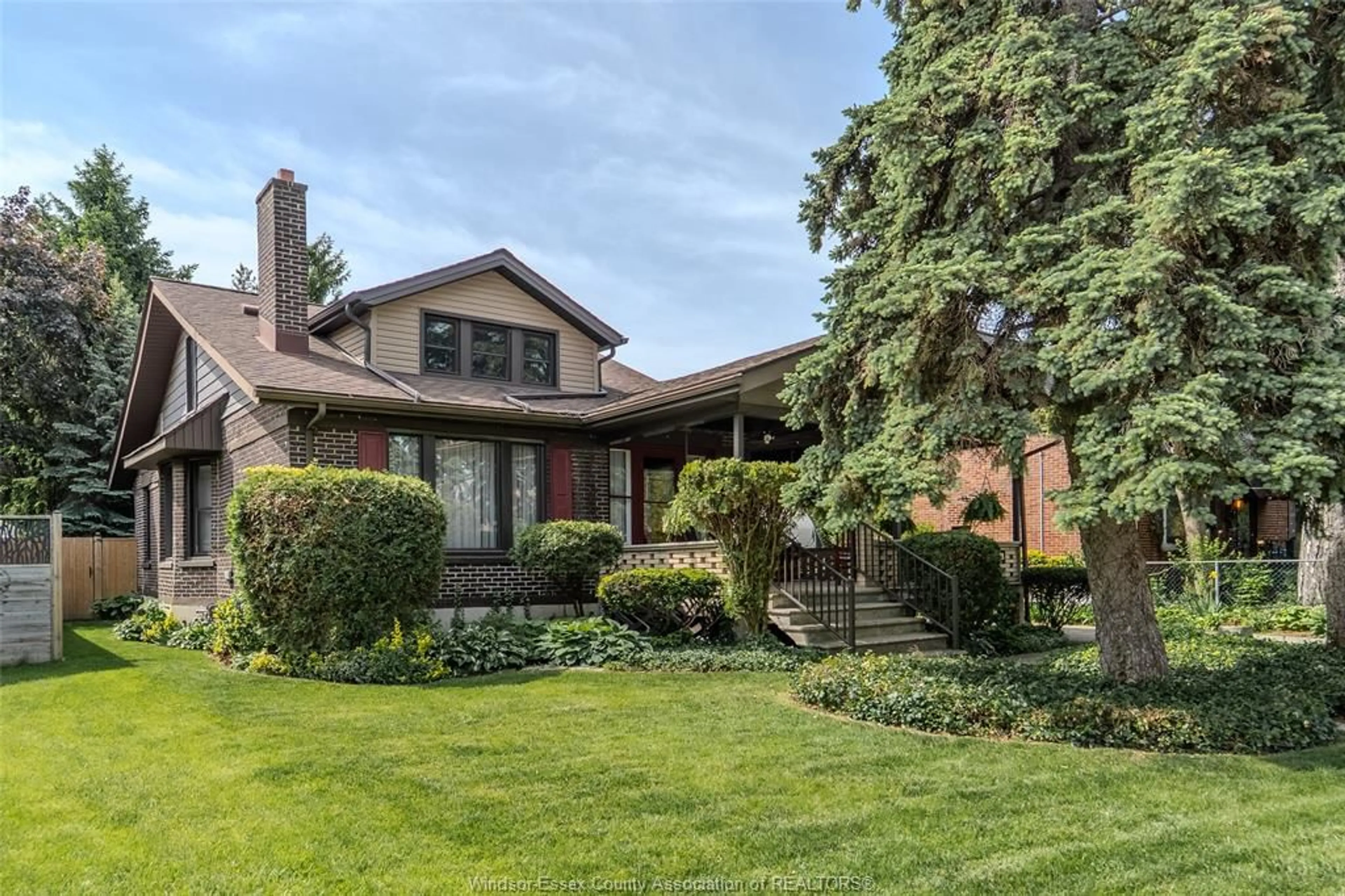 Home with brick exterior material, street for 6151 Wyandotte St, Windsor Ontario N8S 1N4