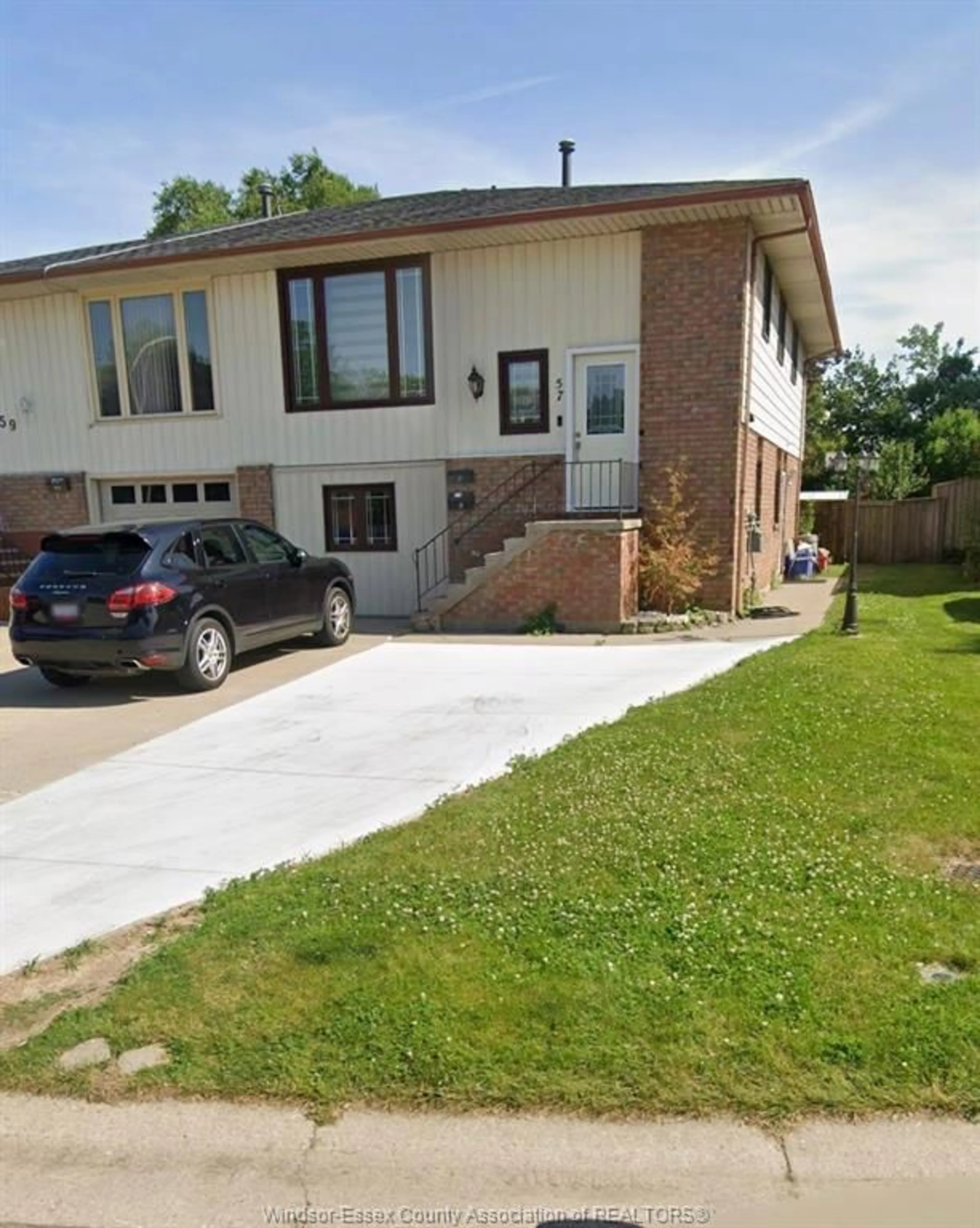 Home with brick exterior material, street for 57 WINDWOOD Dr, Leamington Ontario N8H 4M8