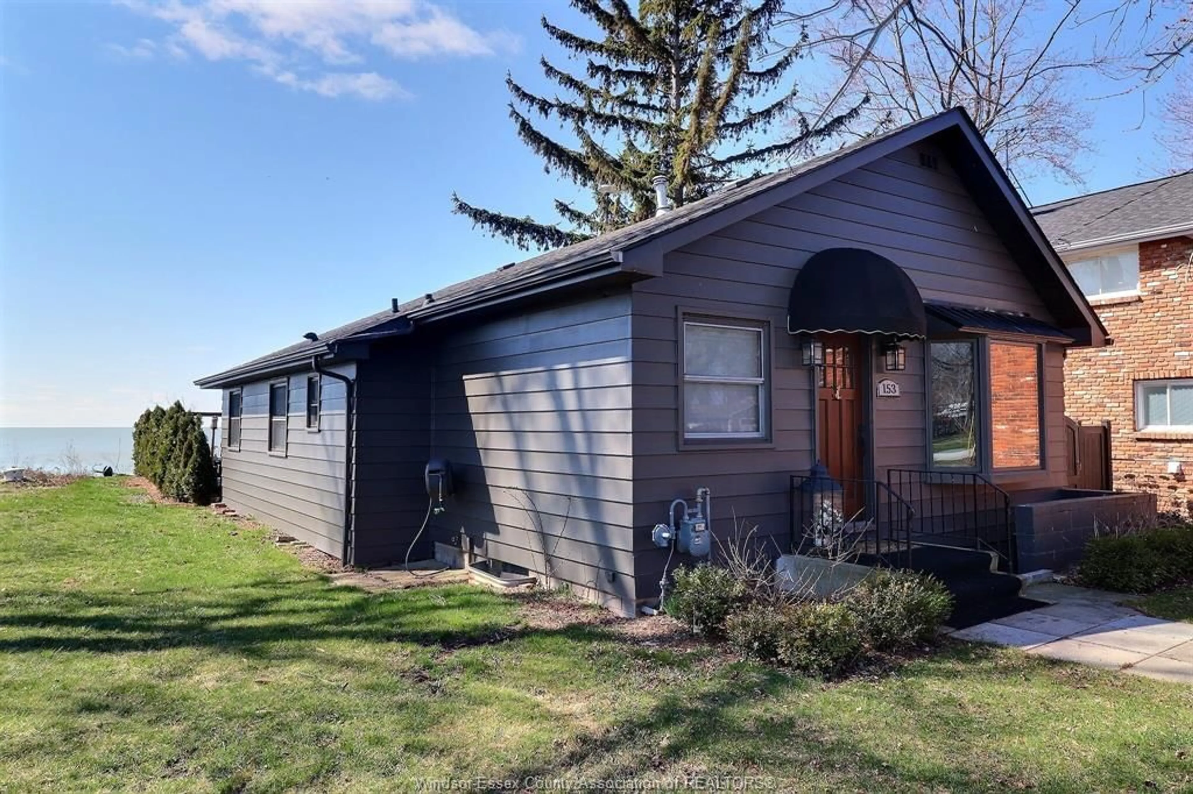 Home with vinyl exterior material, street for 153 ADELAIDE St, Essex Ontario N0R 1G0