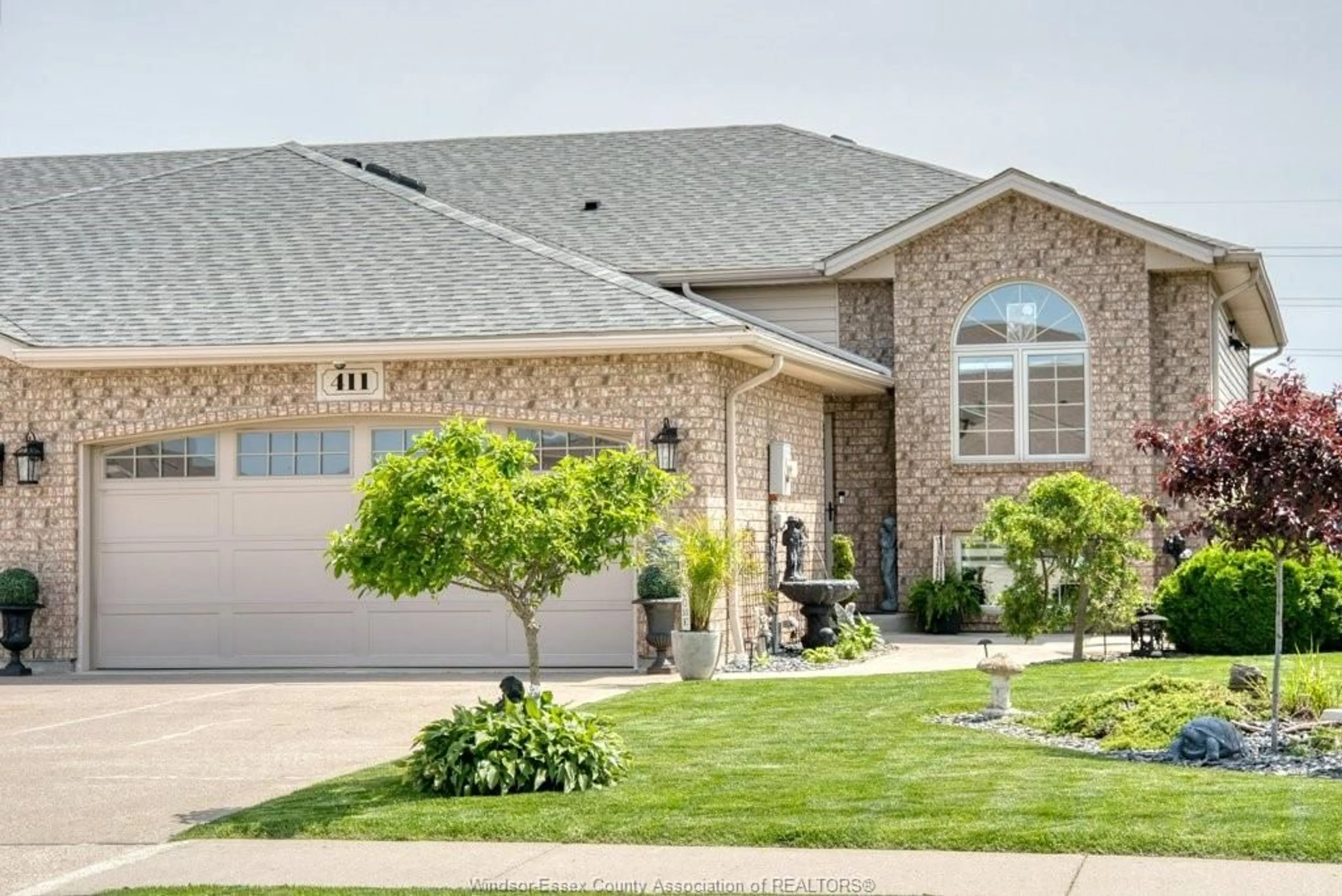 Home with brick exterior material, street for 411 ROSEWOOD Dr, Lakeshore Ontario N8L 1B9