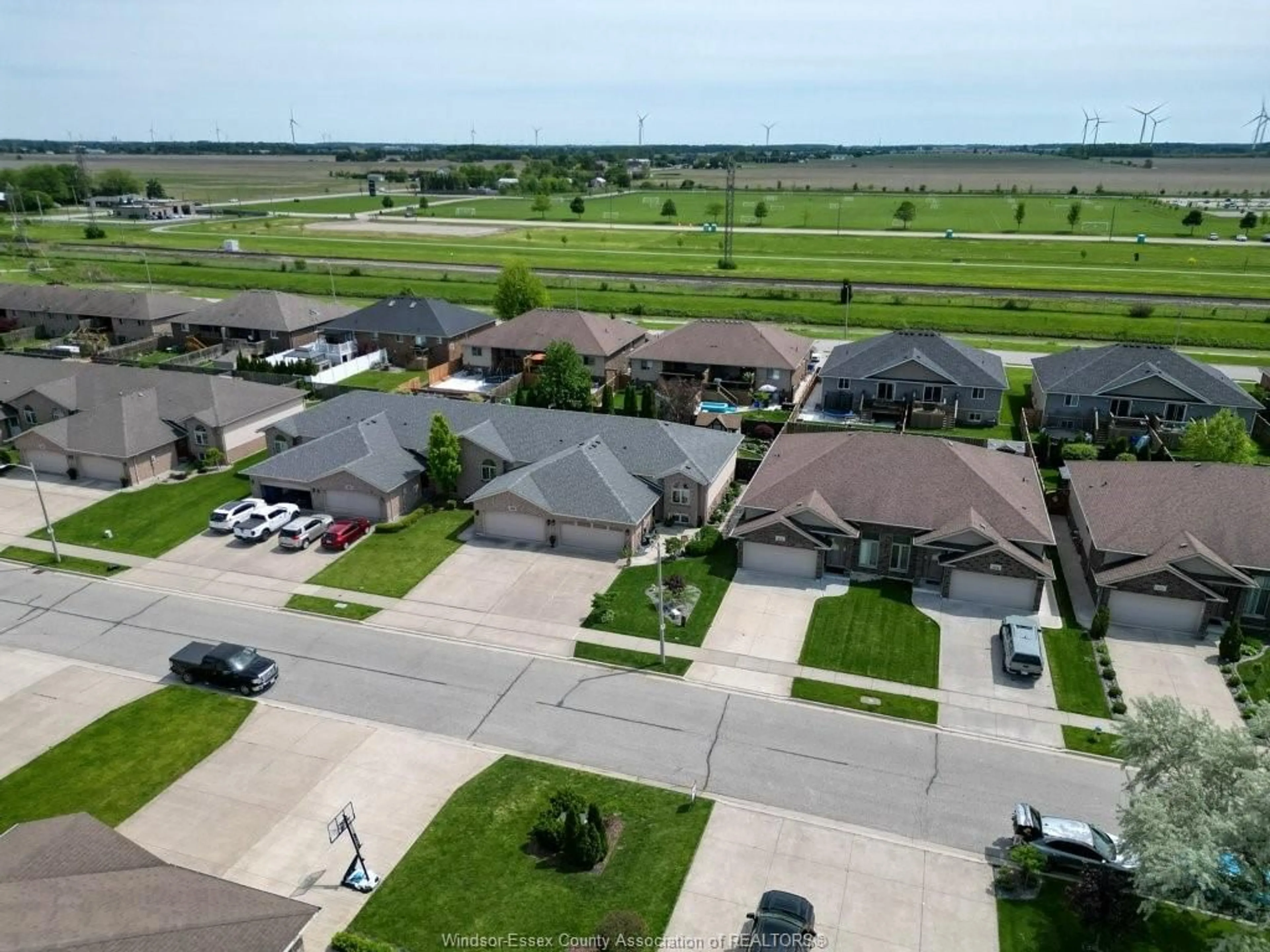 A pic from outside/outdoor area/front of a property/back of a property/a pic from drone, street for 411 ROSEWOOD Dr, Lakeshore Ontario N8L 1B9