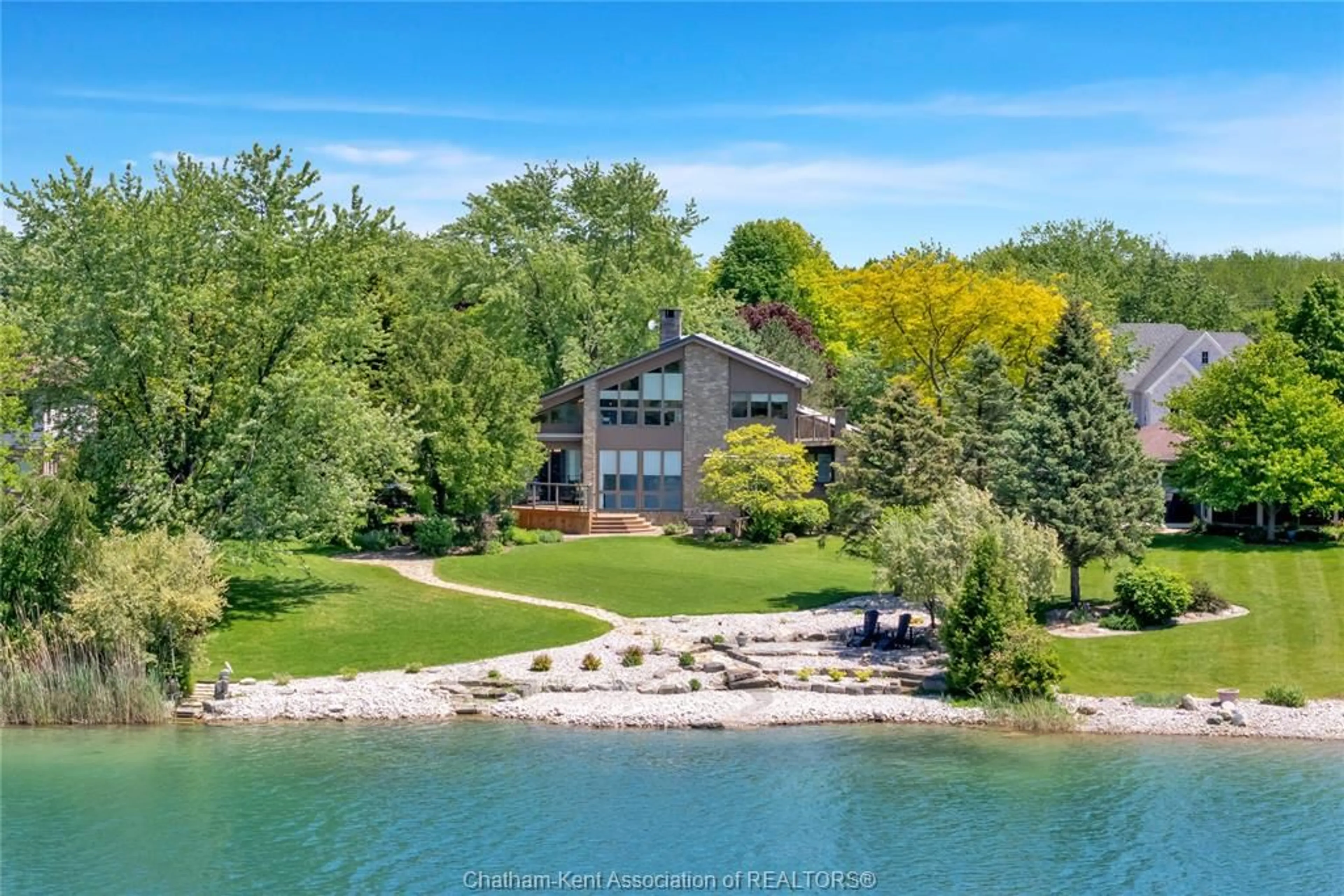 A pic from outside/outdoor area/front of a property/back of a property/a pic from drone, water/lake/river/ocean view for 10691 Lakeview Dr, Chatham Ontario N7M 5J3