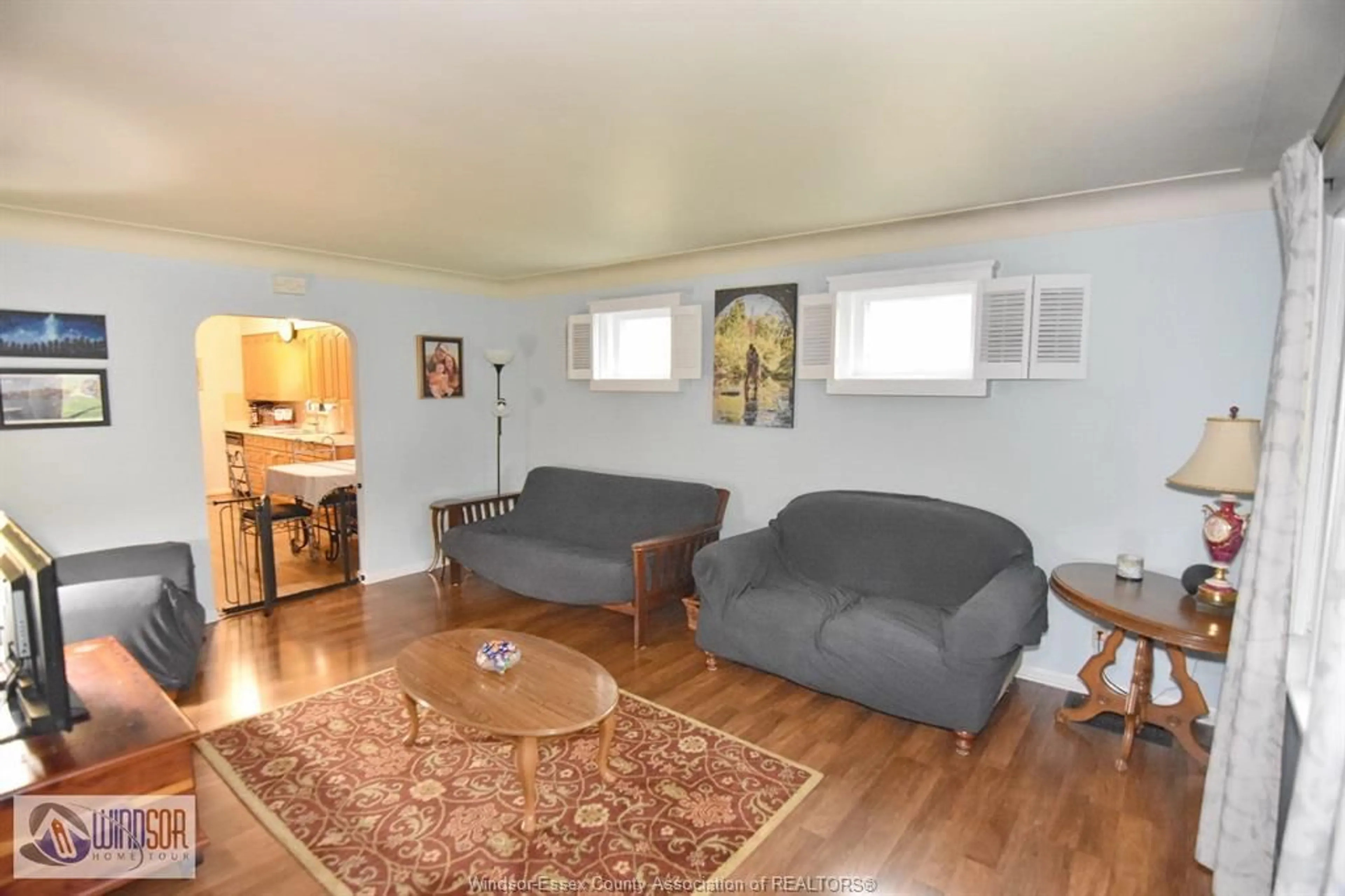Living room with furniture, wood/laminate floor for 1224 BELLE ISLE VIEW, Windsor Ontario N8S 3G7