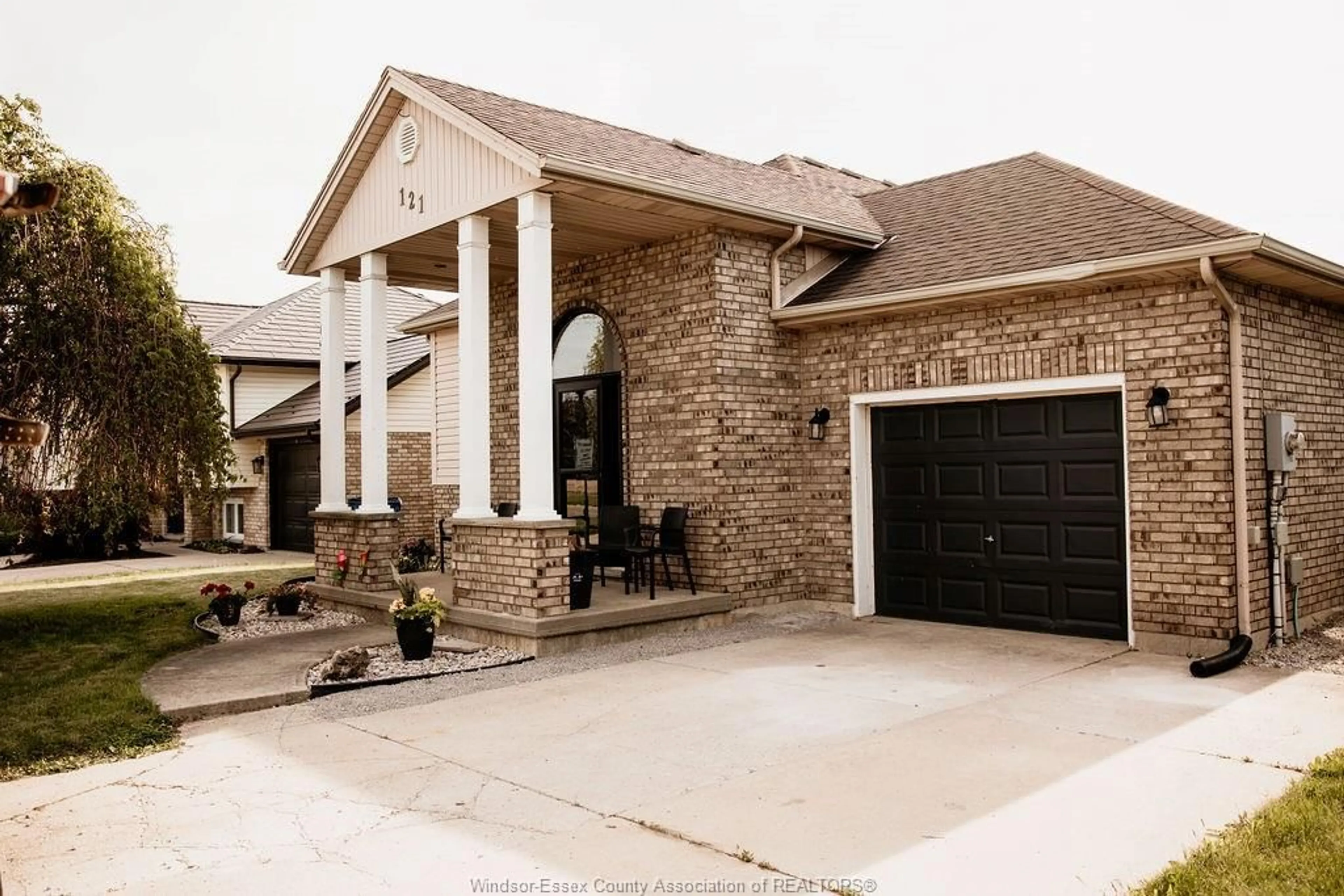 Home with brick exterior material, street for 121 Queen St. South, Tilbury Ontario N0P 2L0