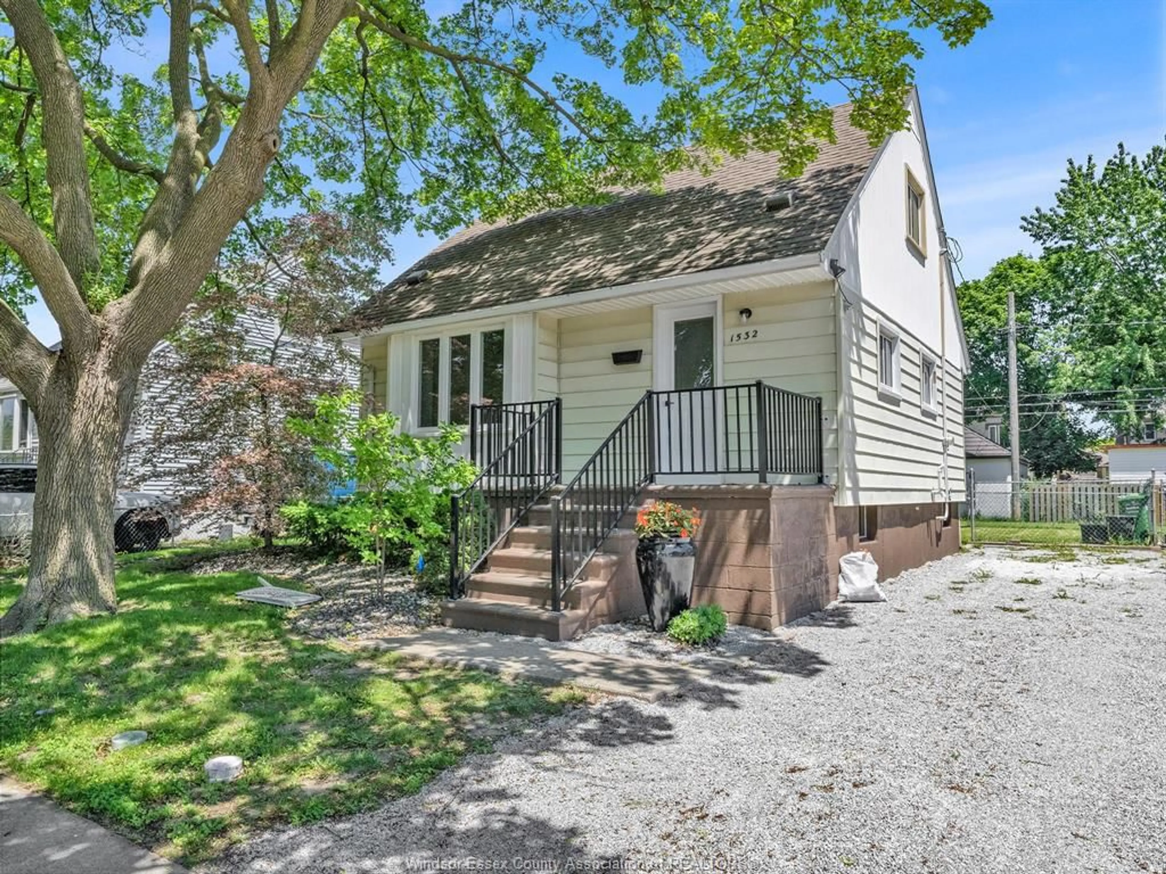 Home with vinyl exterior material, street for 1532 TOURANGEAU Rd, Windsor Ontario N8Y 4J4
