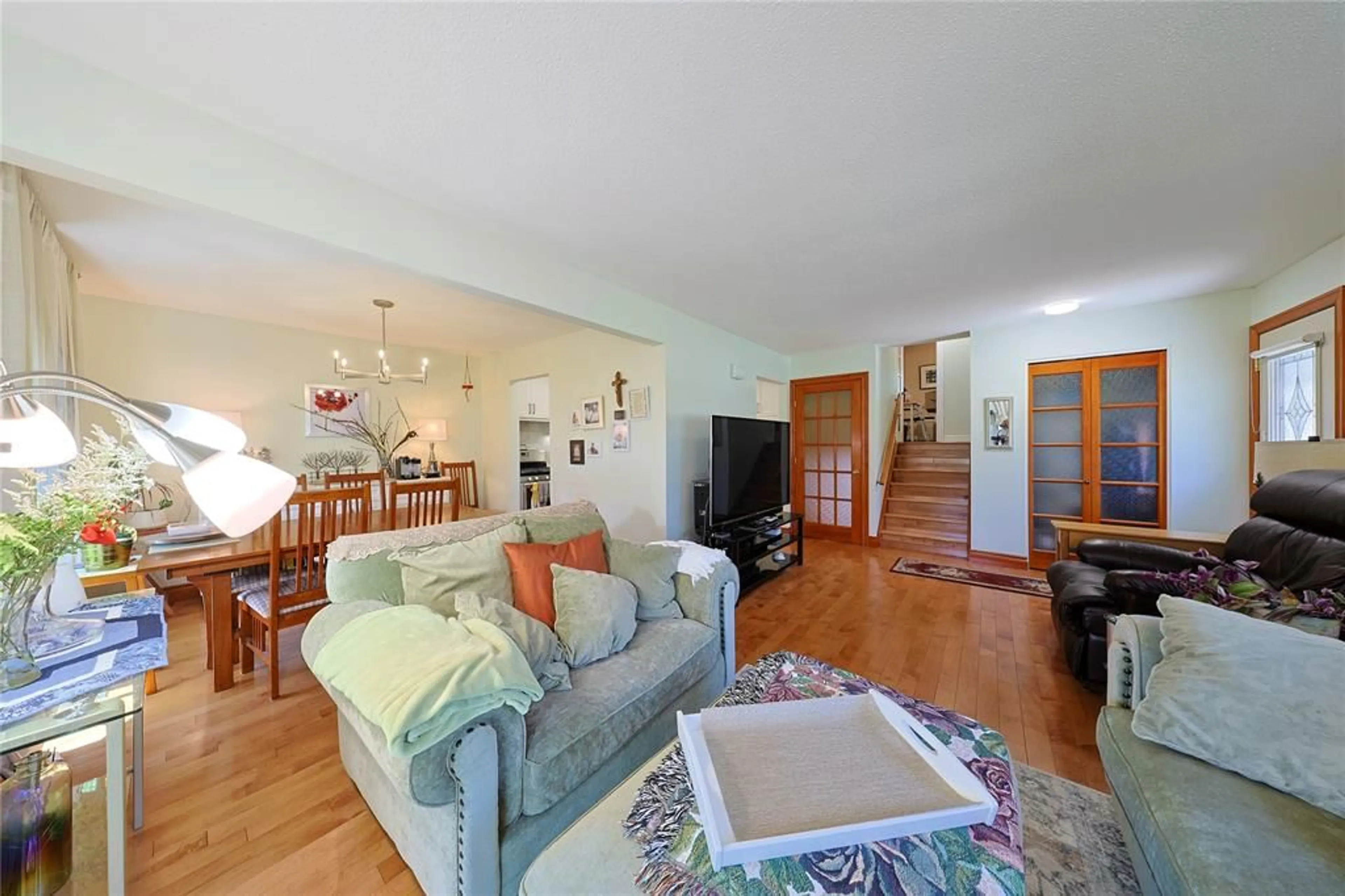 Living room with furniture, wood/laminate floor for 22 Turner Dr, Sarnia Ontario N7S 4L1