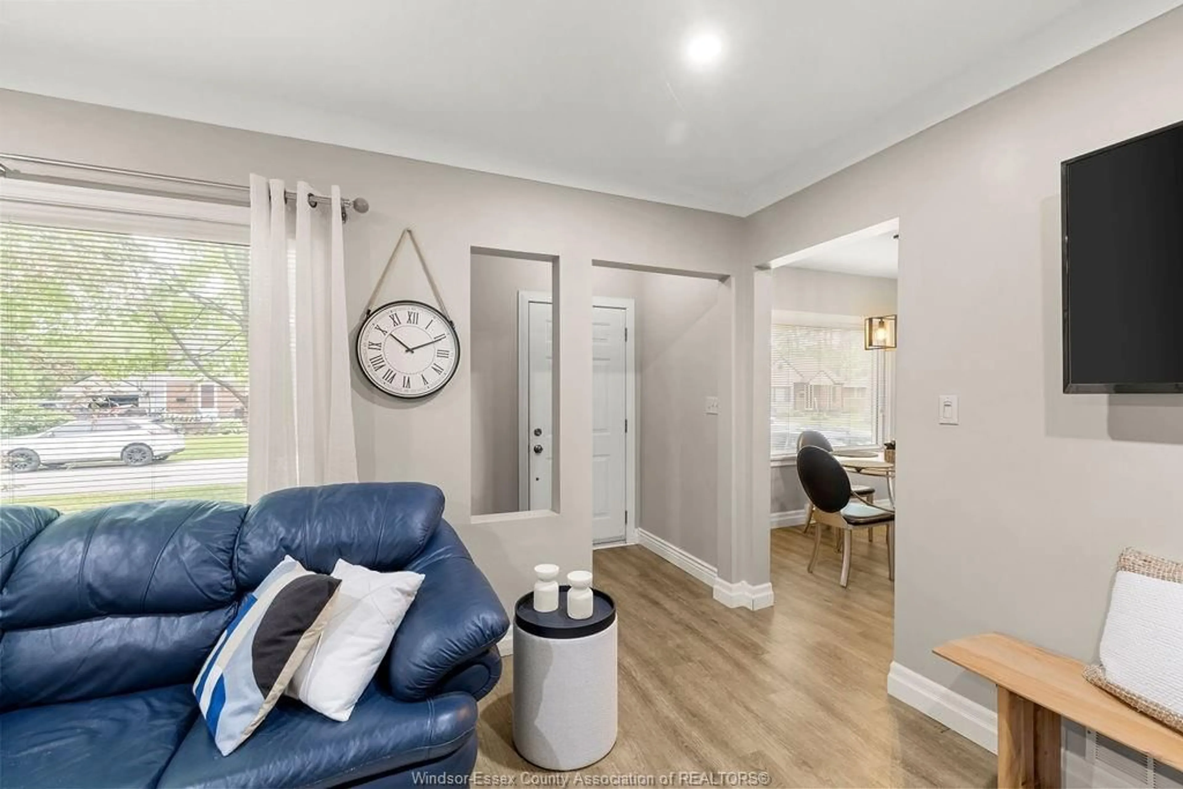 Living room with furniture, wood/laminate floor for 3450 CHURCH, Windsor Ontario N9E 1V5
