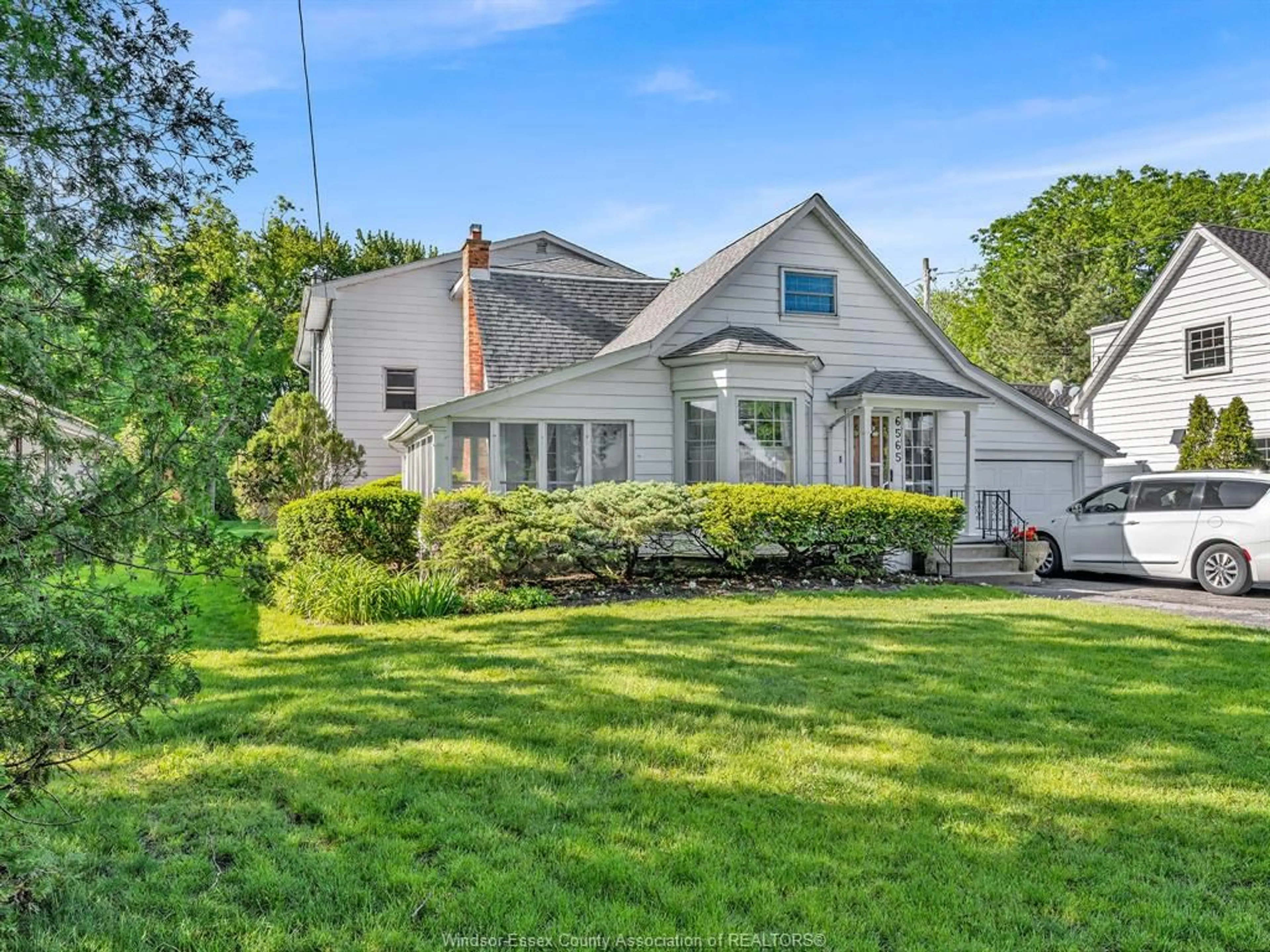 A pic from outside/outdoor area/front of a property/back of a property/a pic from drone, street for 6565 RIVERSIDE Dr, Windsor Ontario N8S 1C1