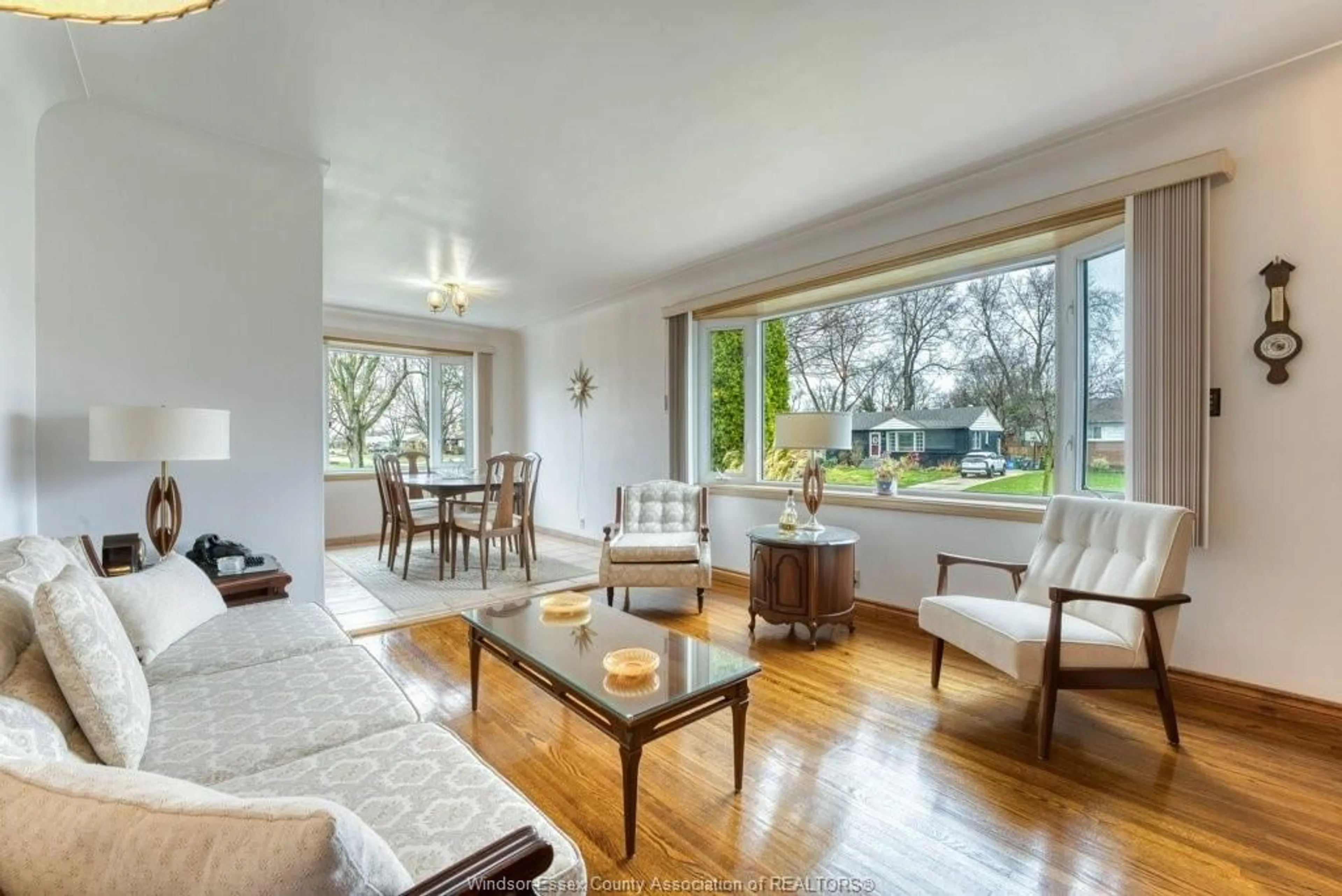 Living room with furniture, wood/laminate floor for 3603 Rockwell Blvd, Windsor Ontario N9E 2B1