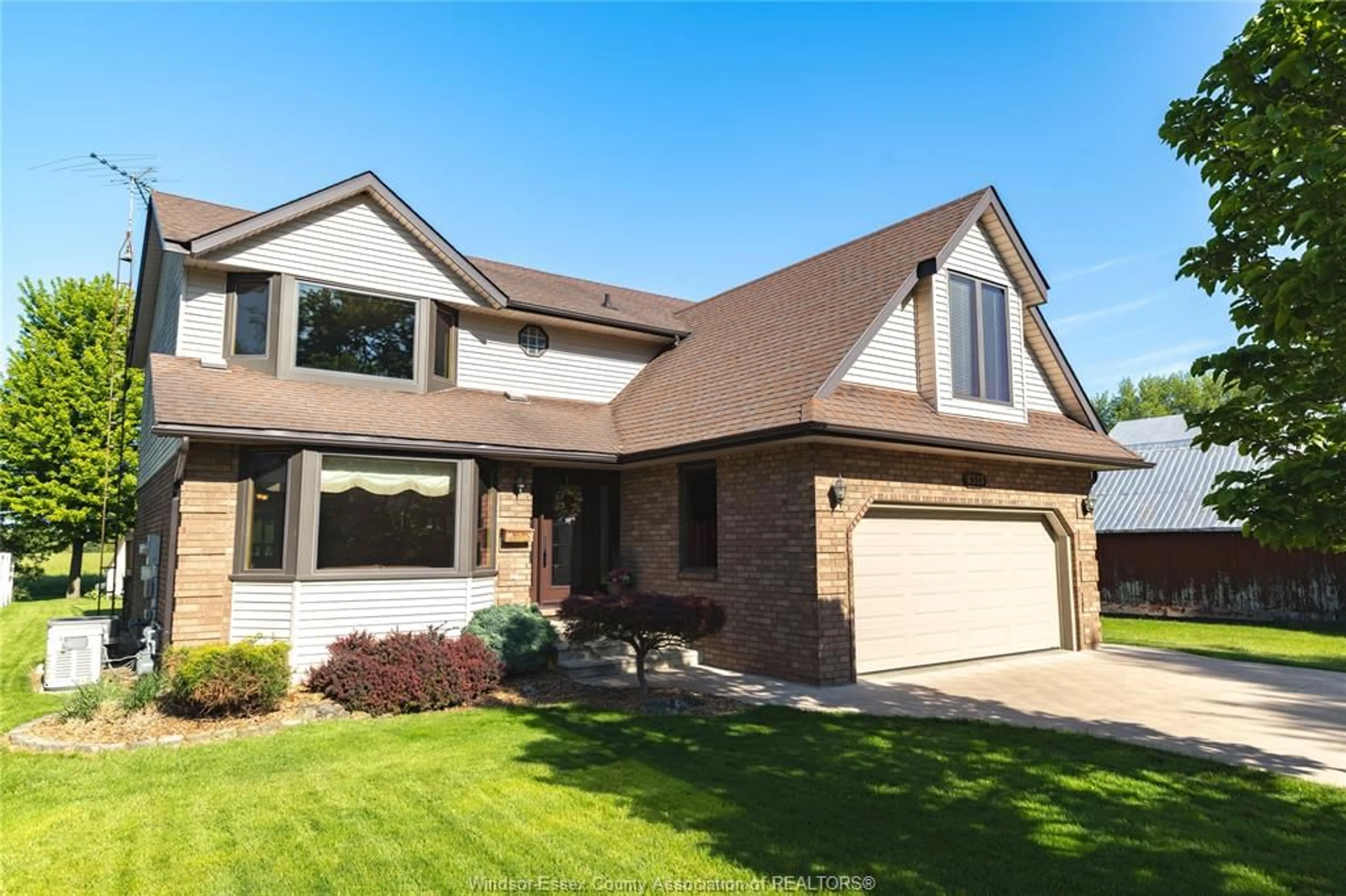 Home with brick exterior material, street for 6335 AINSLIE Ave, Lakeshore Ontario N0P 1J0