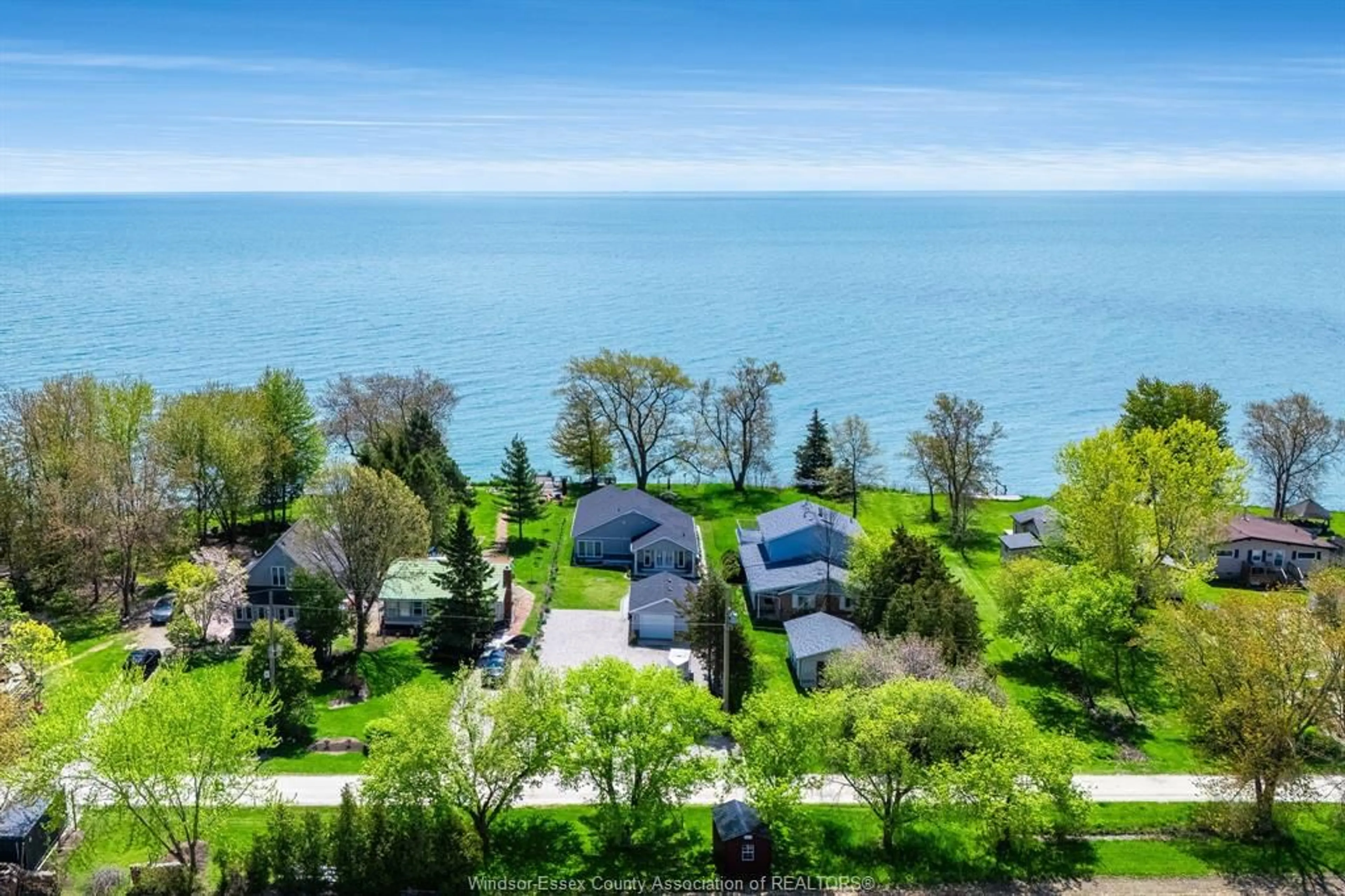 A pic from outside/outdoor area/front of a property/back of a property/a pic from drone, water/lake/river/ocean view for 952 Hiawatha Beach, Wheatley Ontario N0P 2P0