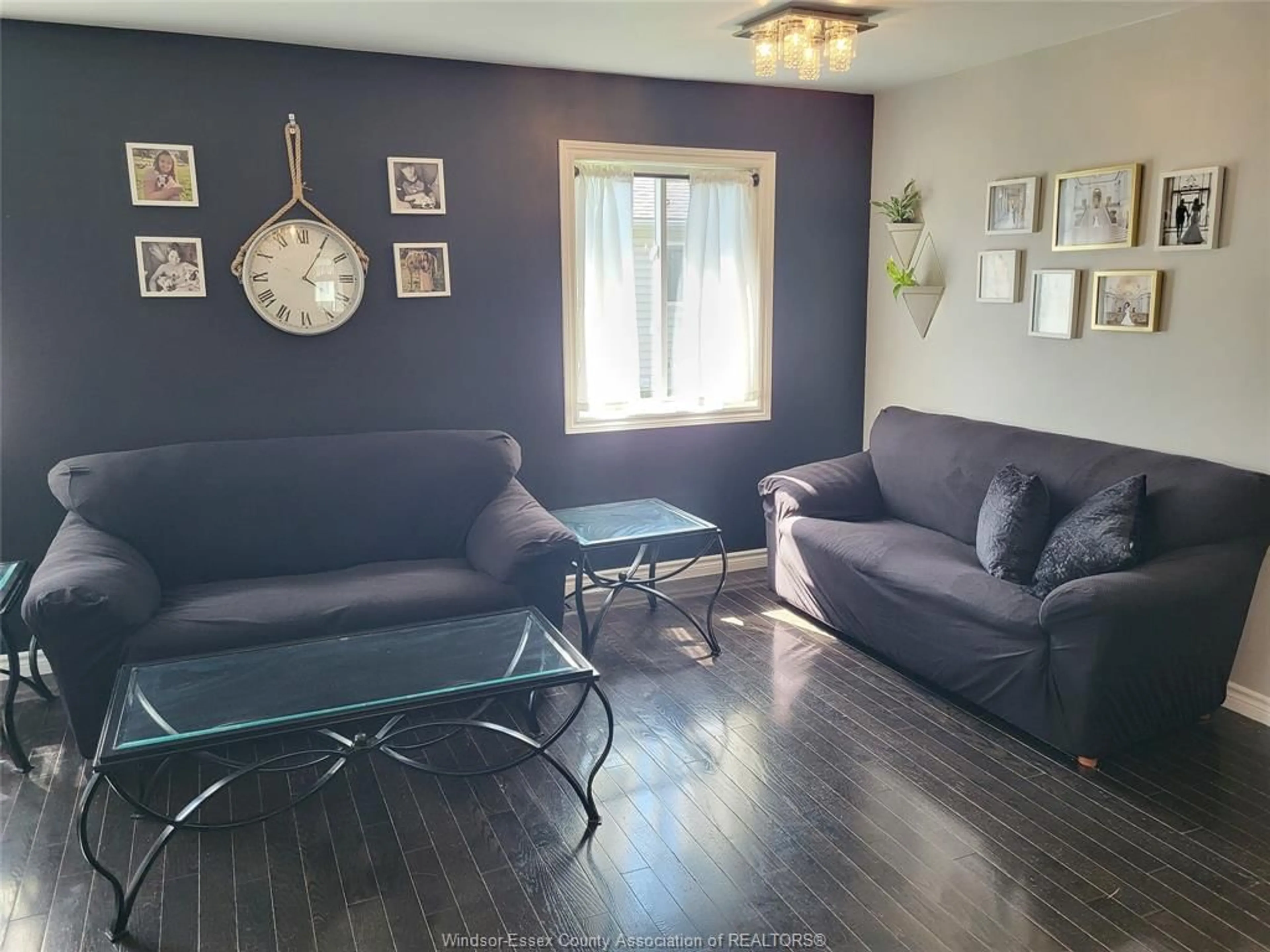 Living room with furniture, wood/laminate floor for 2324 LAMONT St, Windsor Ontario N9E 4X3