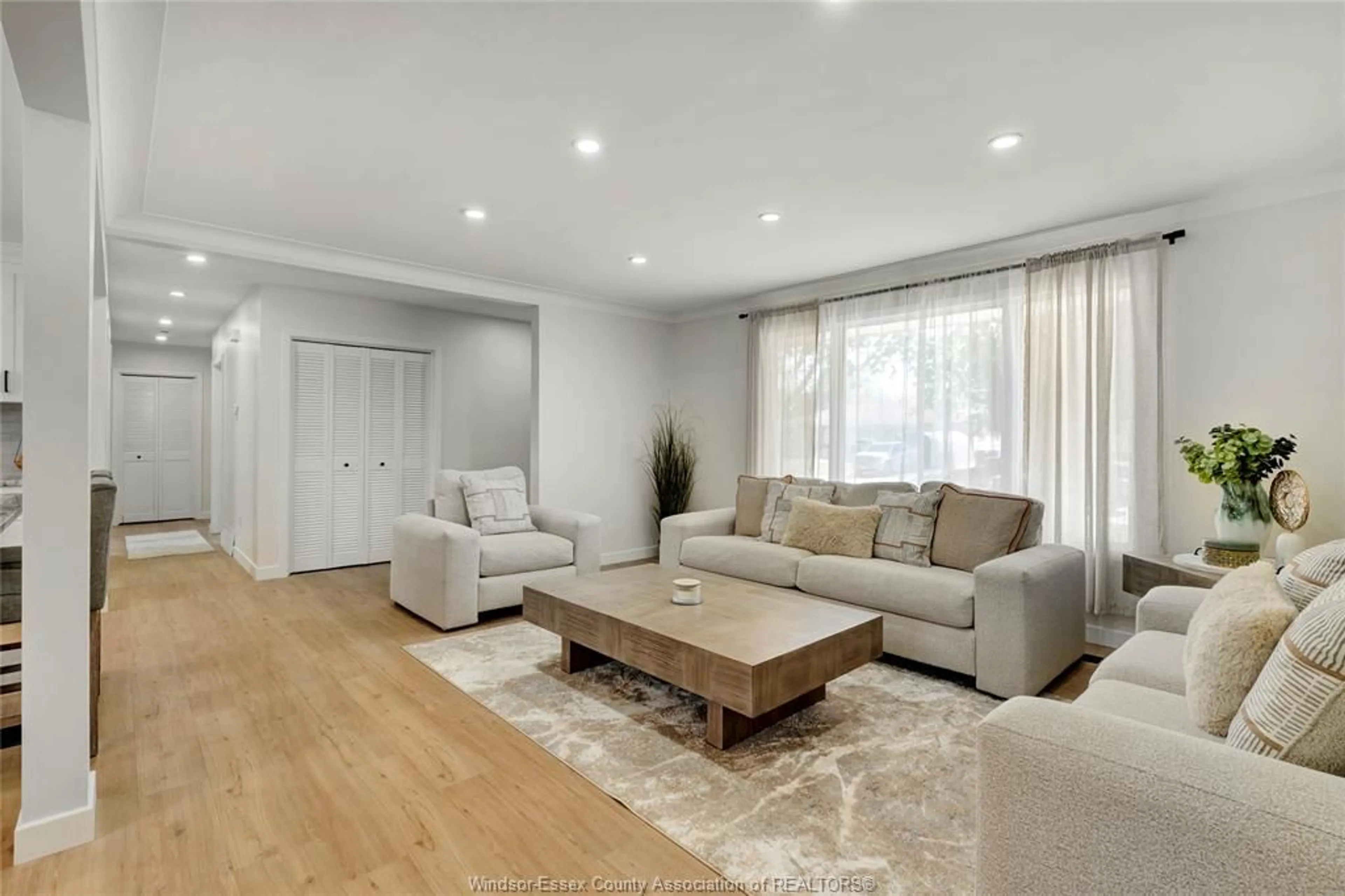 Living room with furniture, wood/laminate floor for 1910 KENT St, Windsor Ontario N9E 3R3