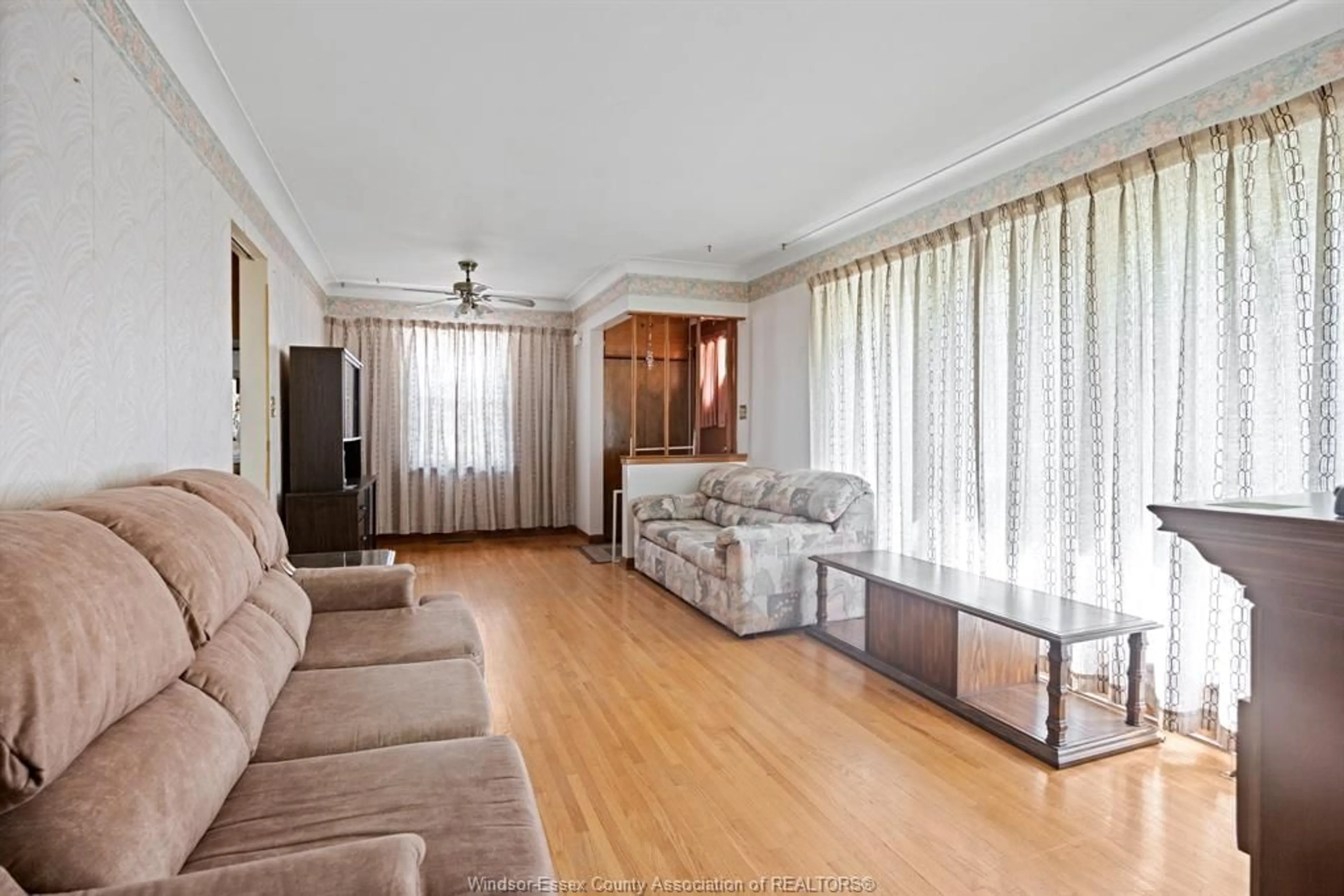 Living room with furniture, wood/laminate floor for 371 ST. MARKS, Tecumseh Ontario N8N 2H6
