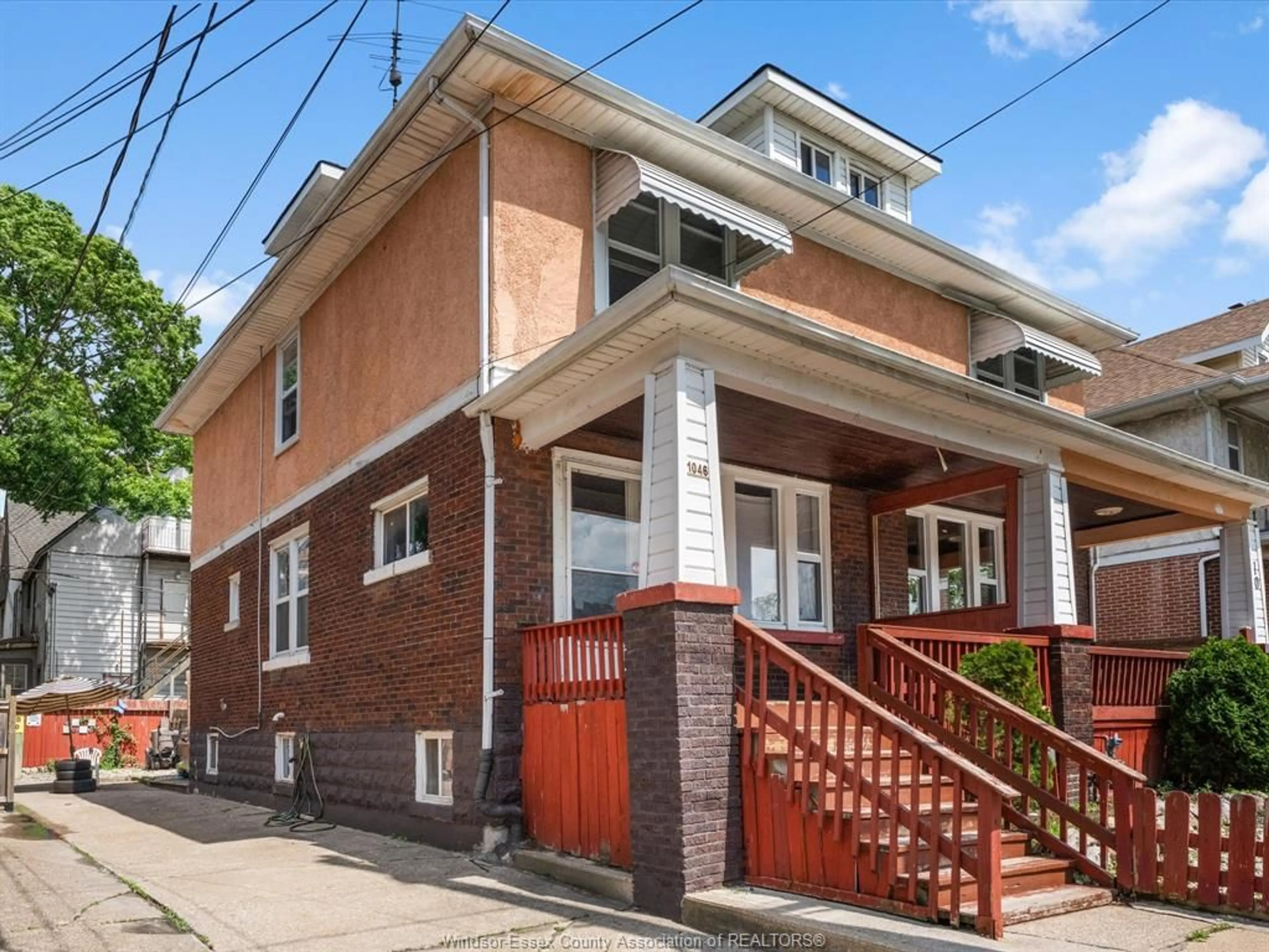 Home with brick exterior material, street for 1046-1048 Pelissier, Windsor Ontario N9A 4L7