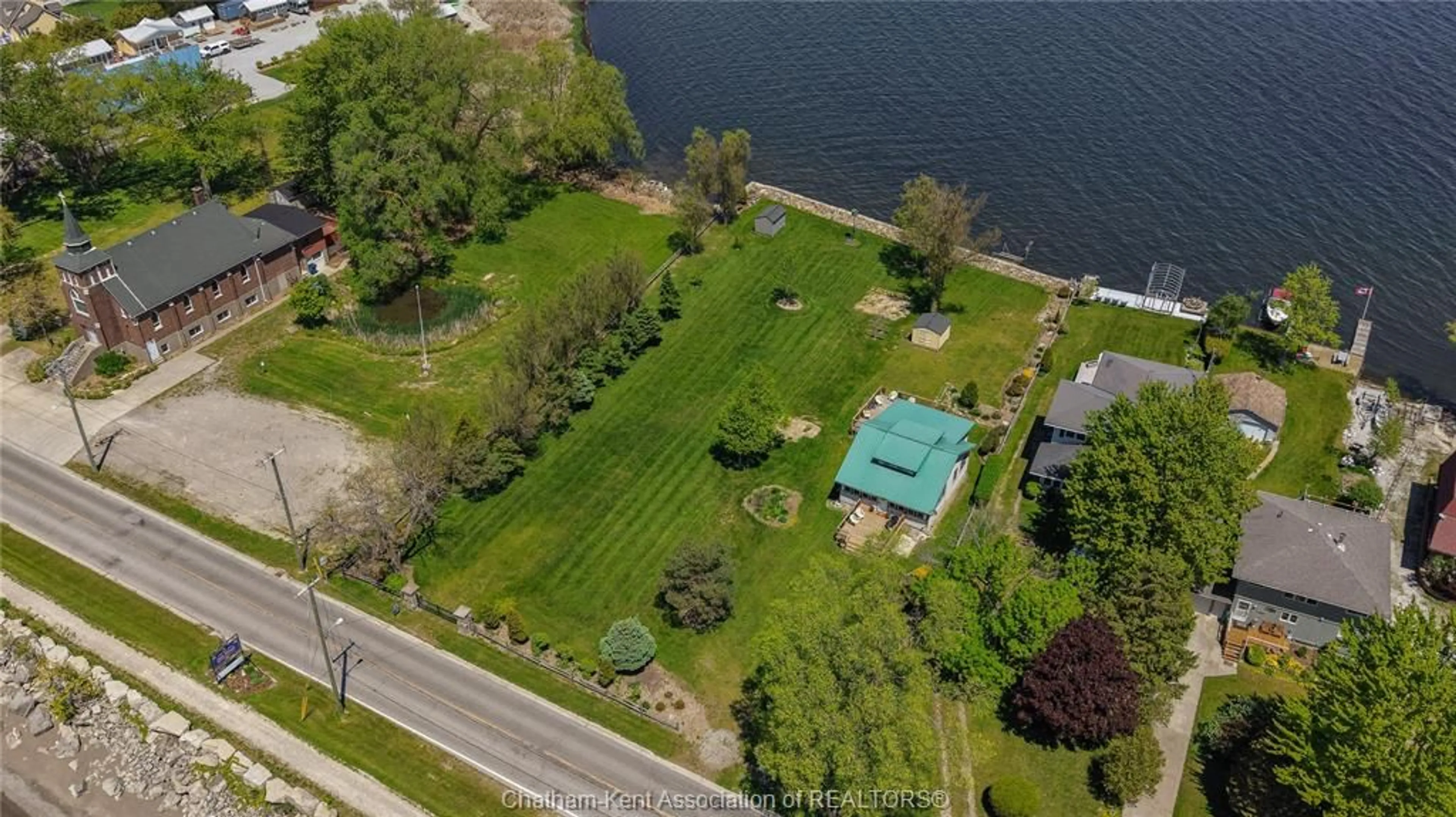 A pic from outside/outdoor area/front of a property/back of a property/a pic from drone, water/lake/river/ocean view for 100 ROSS Lane, Erieau Ontario N0P 1N0