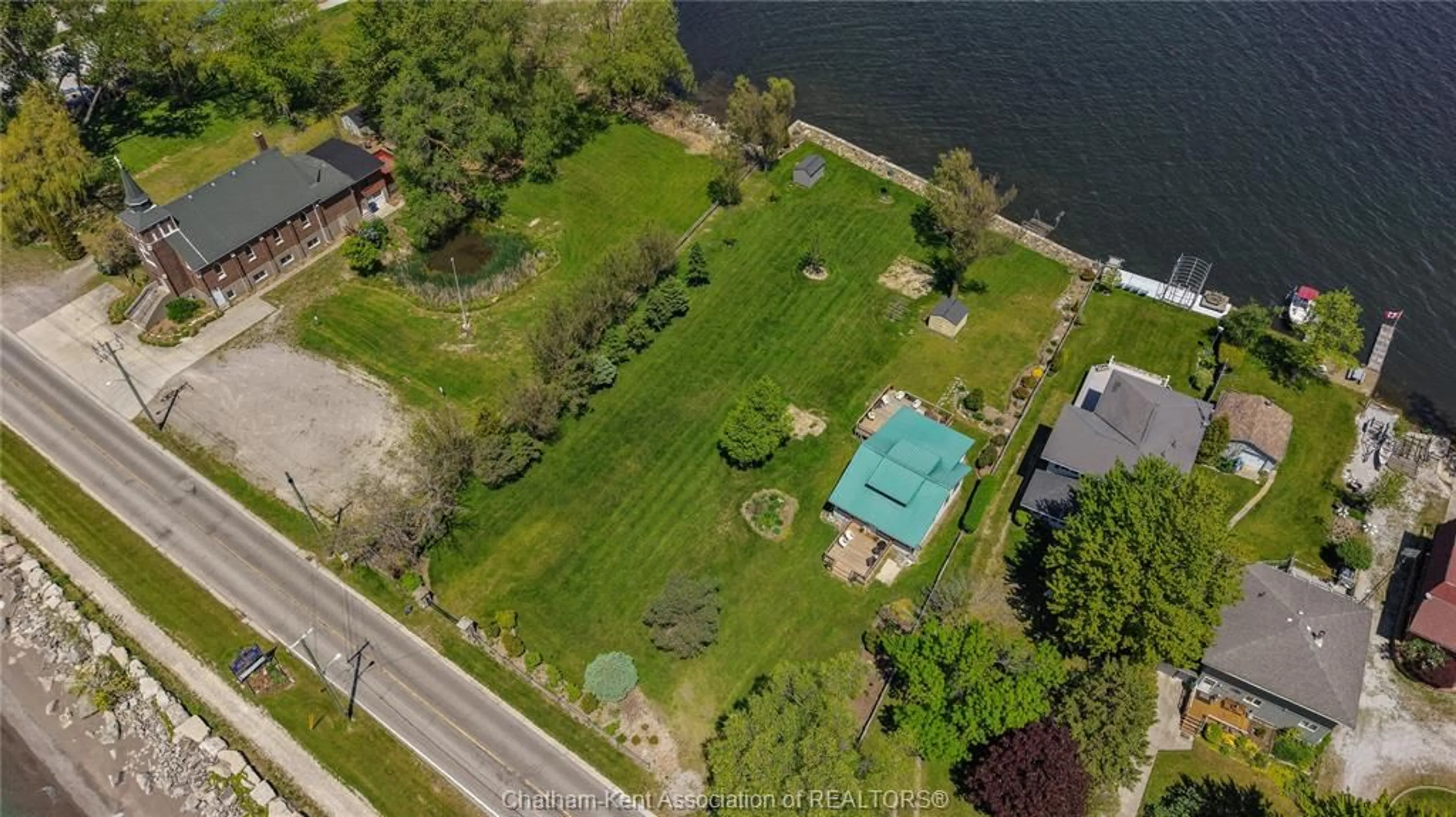 A pic from outside/outdoor area/front of a property/back of a property/a pic from drone, water/lake/river/ocean view for 100 ROSS Lane, Erieau Ontario N0P 1N0