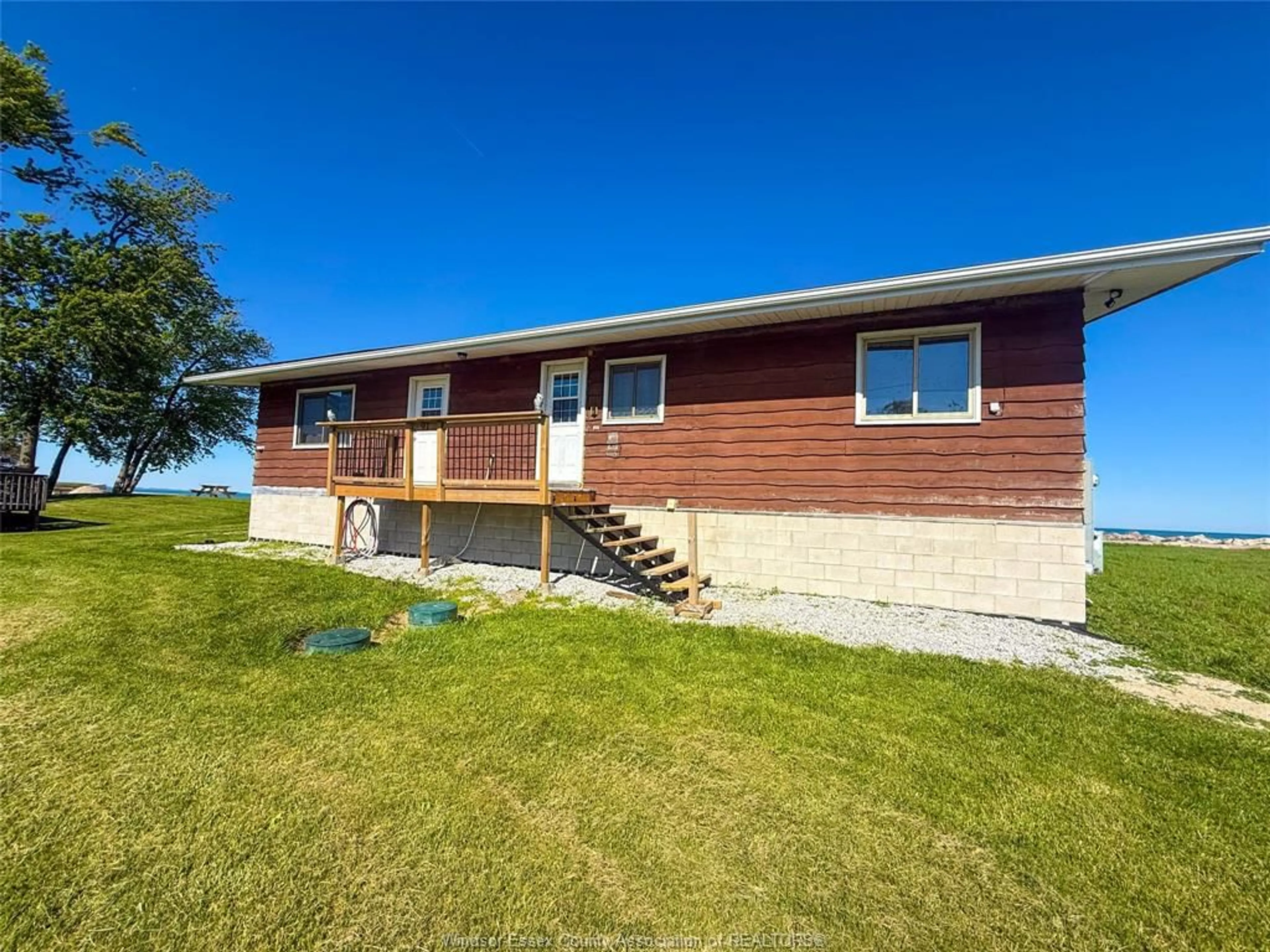 A pic from outside/outdoor area/front of a property/back of a property/a pic from drone, water/lake/river/ocean view for 91 MARENTETTE BEACH Rd, Leamington Ontario N8H 3V7