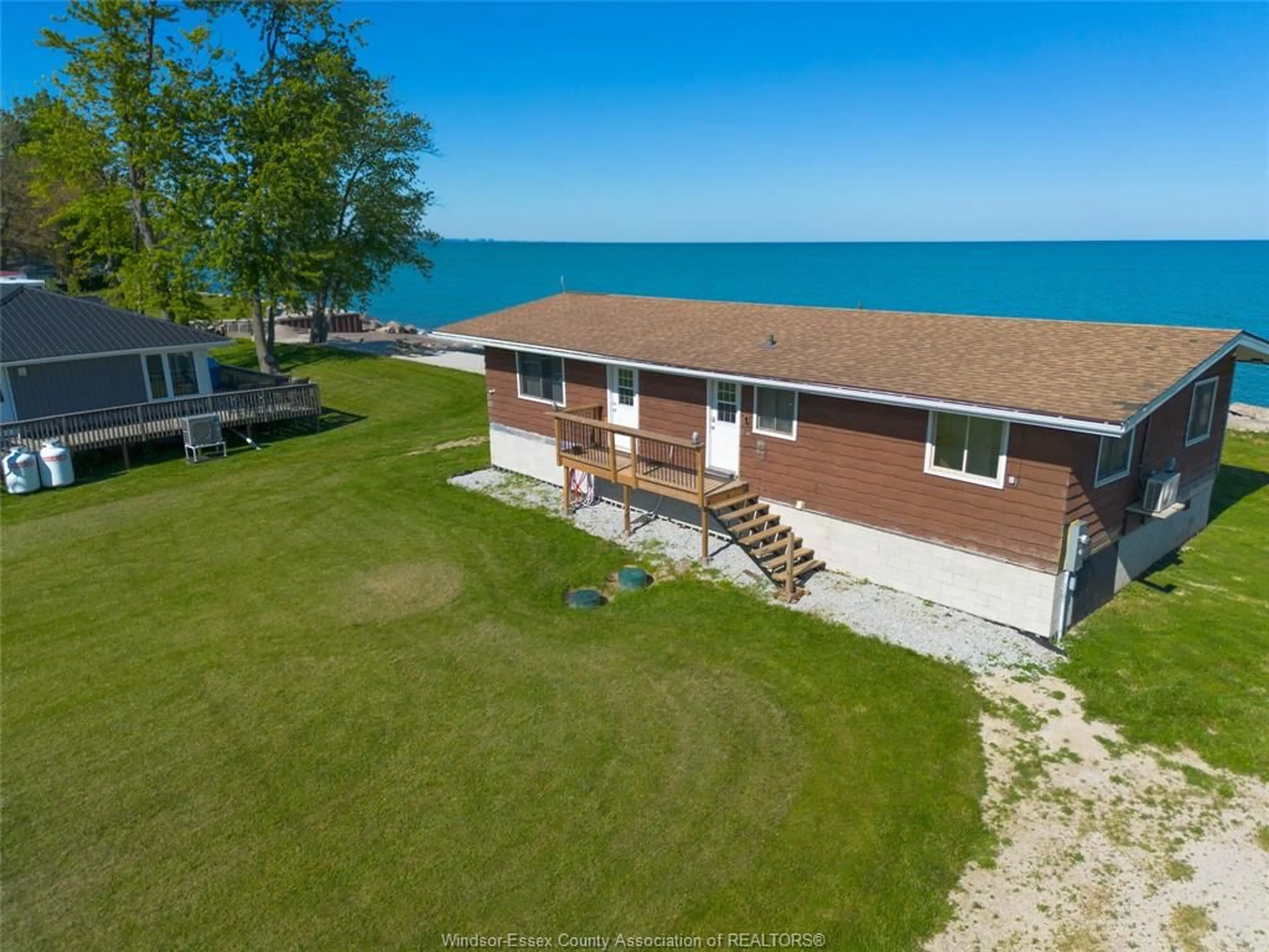 A pic from outside/outdoor area/front of a property/back of a property/a pic from drone, water/lake/river/ocean view for 91 MARENTETTE BEACH Rd, Leamington Ontario N8H 3V7