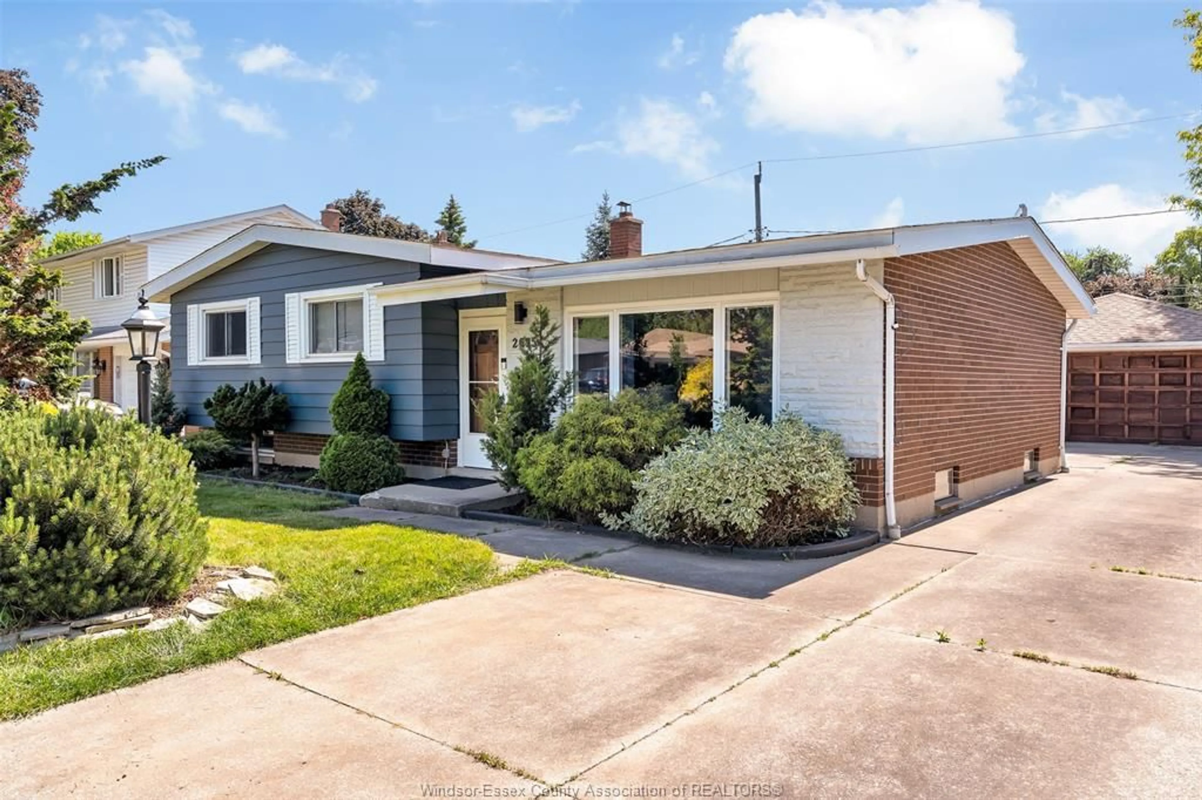 Home with brick exterior material, street for 2695 SIERRA Dr, Windsor Ontario N9E 2Y9