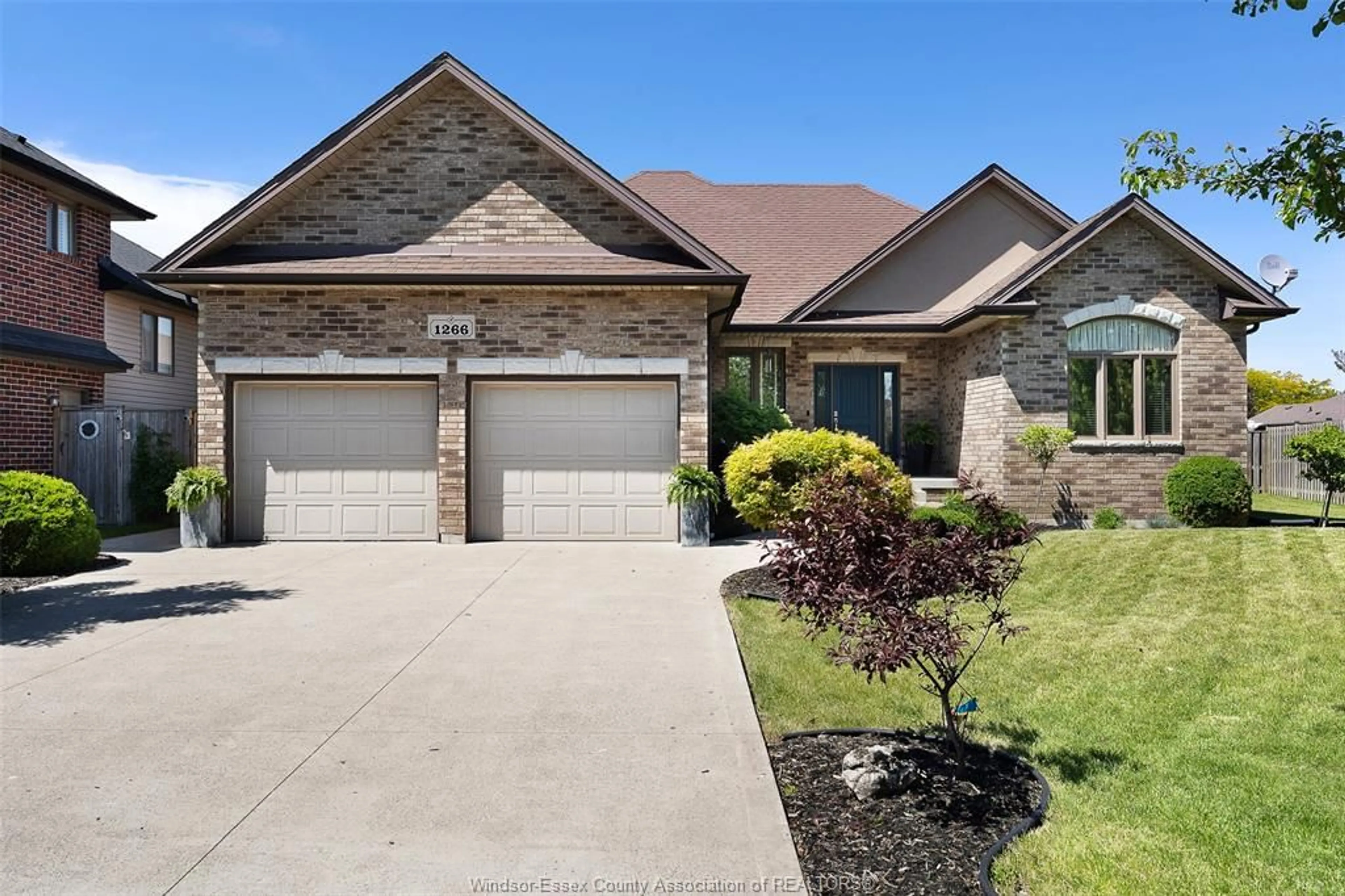 Home with brick exterior material, street for 1266 DEER RUN Trail, Lakeshore Ontario N8L 0S8