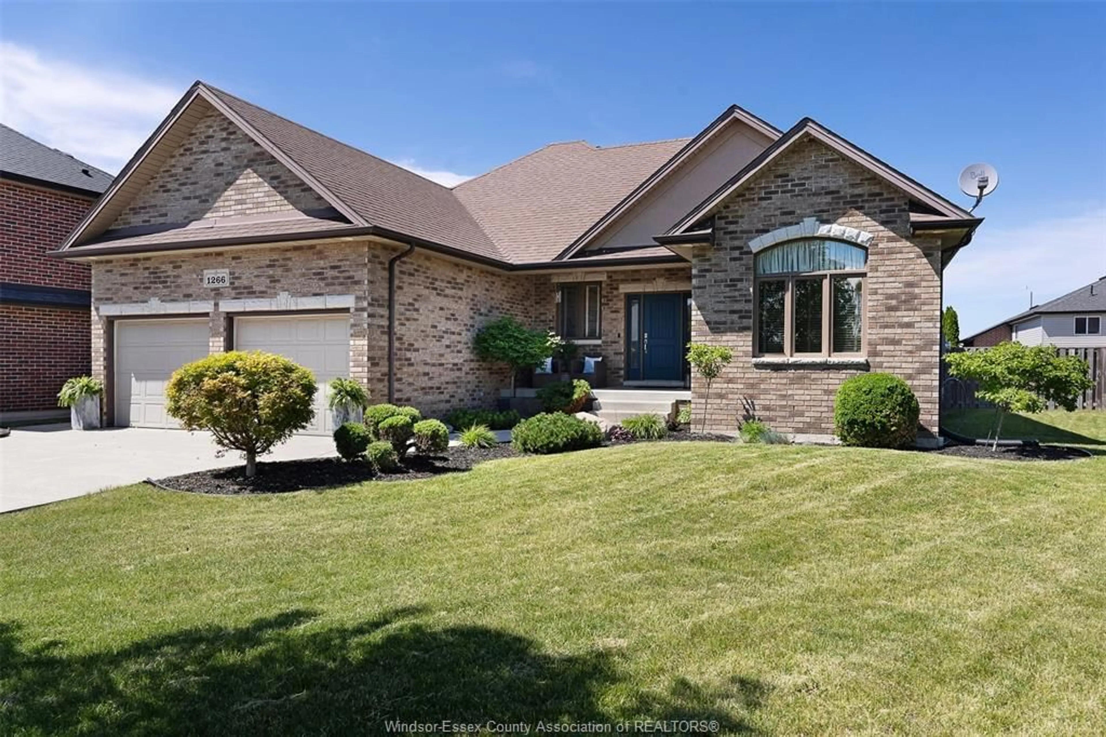 Home with brick exterior material, street for 1266 DEER RUN Trail, Lakeshore Ontario N8L 0S8