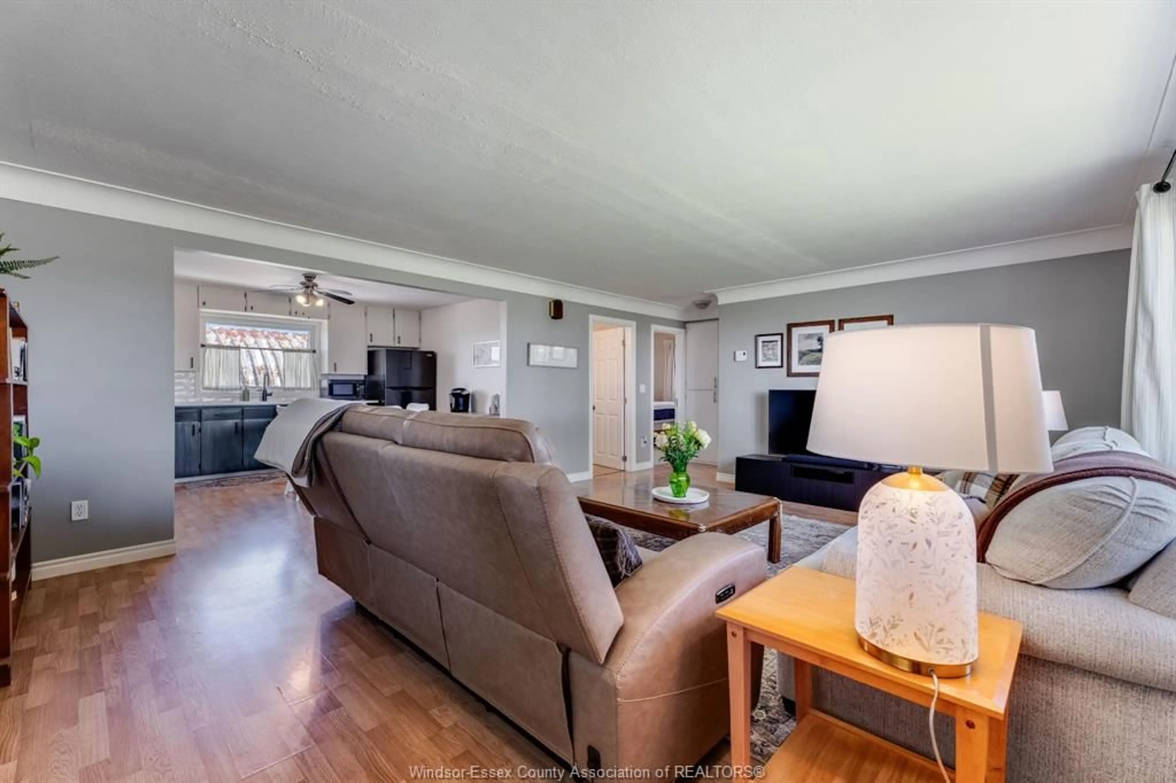 Living room with furniture, wood/laminate floor for 21144 Stevenson Rd, Chatham-Kent Ontario N0P 1H0