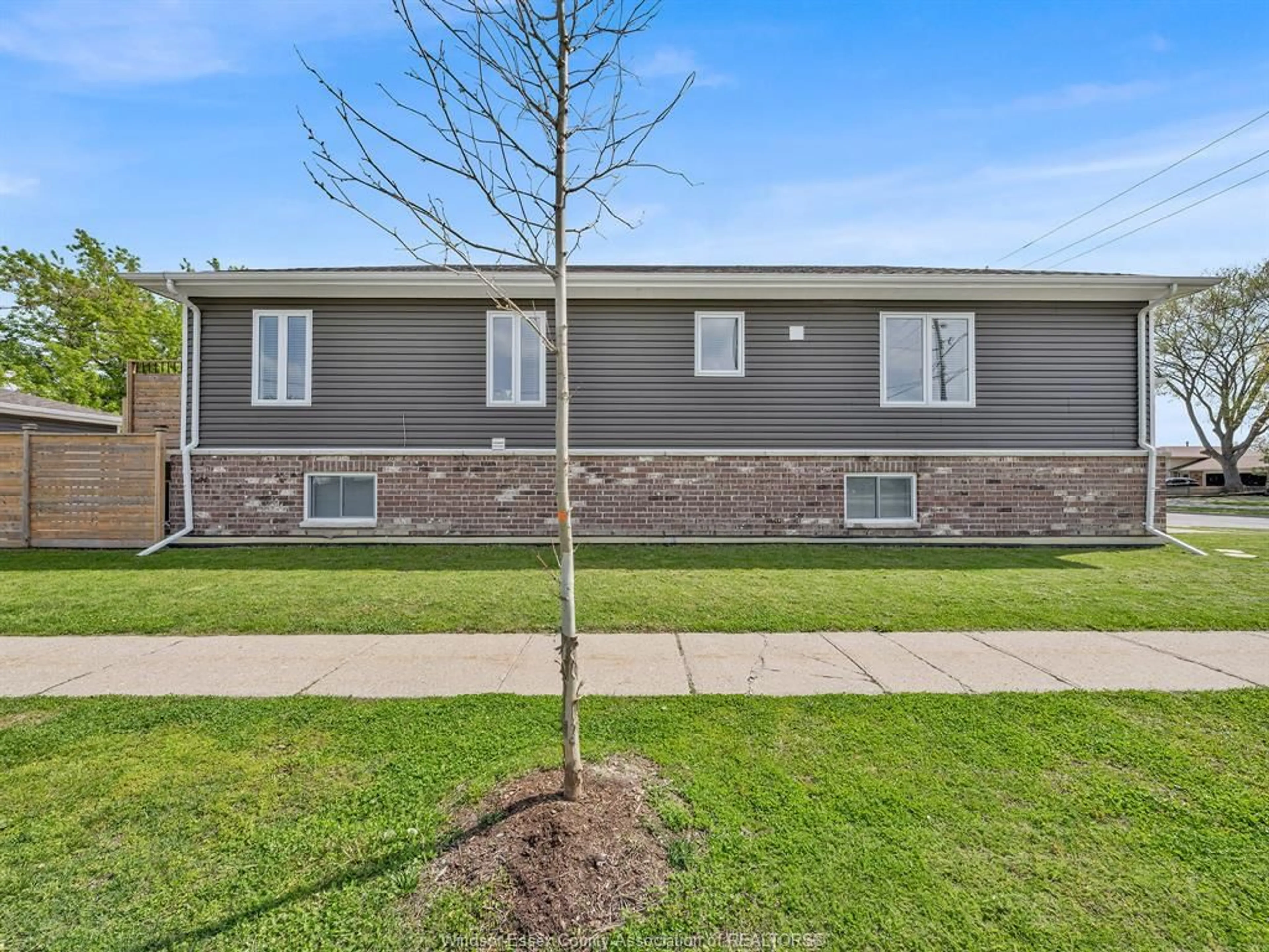 Home with vinyl exterior material, street for 702 LESPERANCE Rd, Tecumseh Ontario N8N 1W7