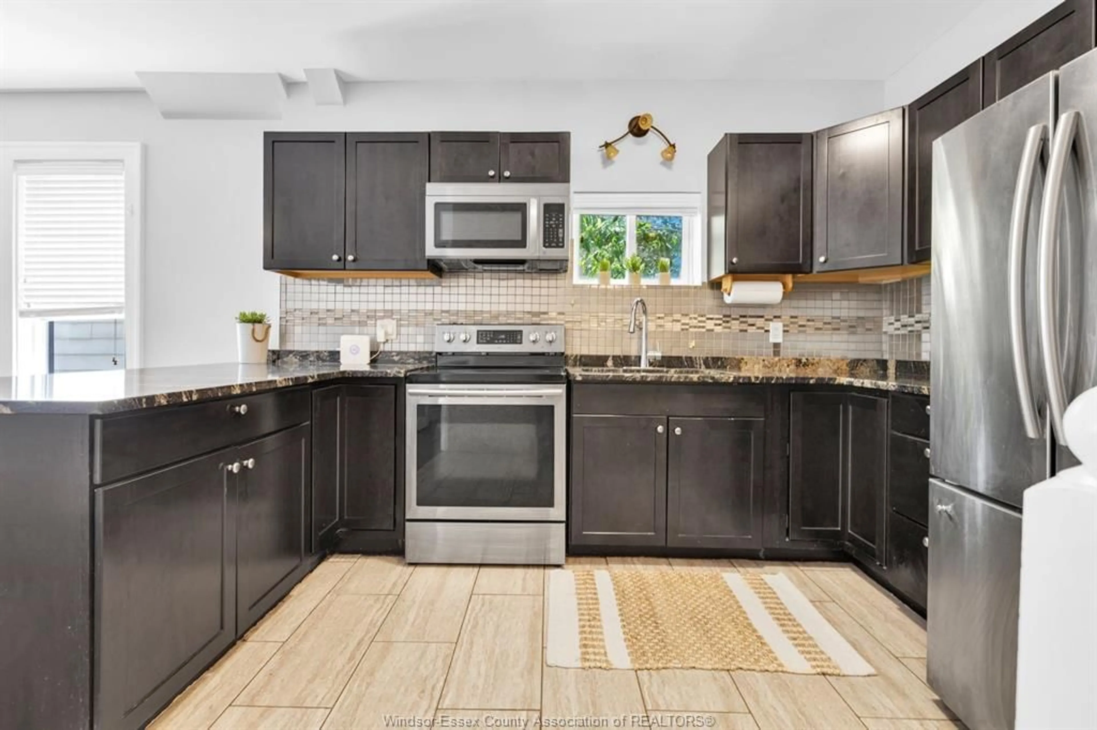 Open concept kitchen, ceramic/tile floor for 1341 McKay, Windsor Ontario N9B 2B1