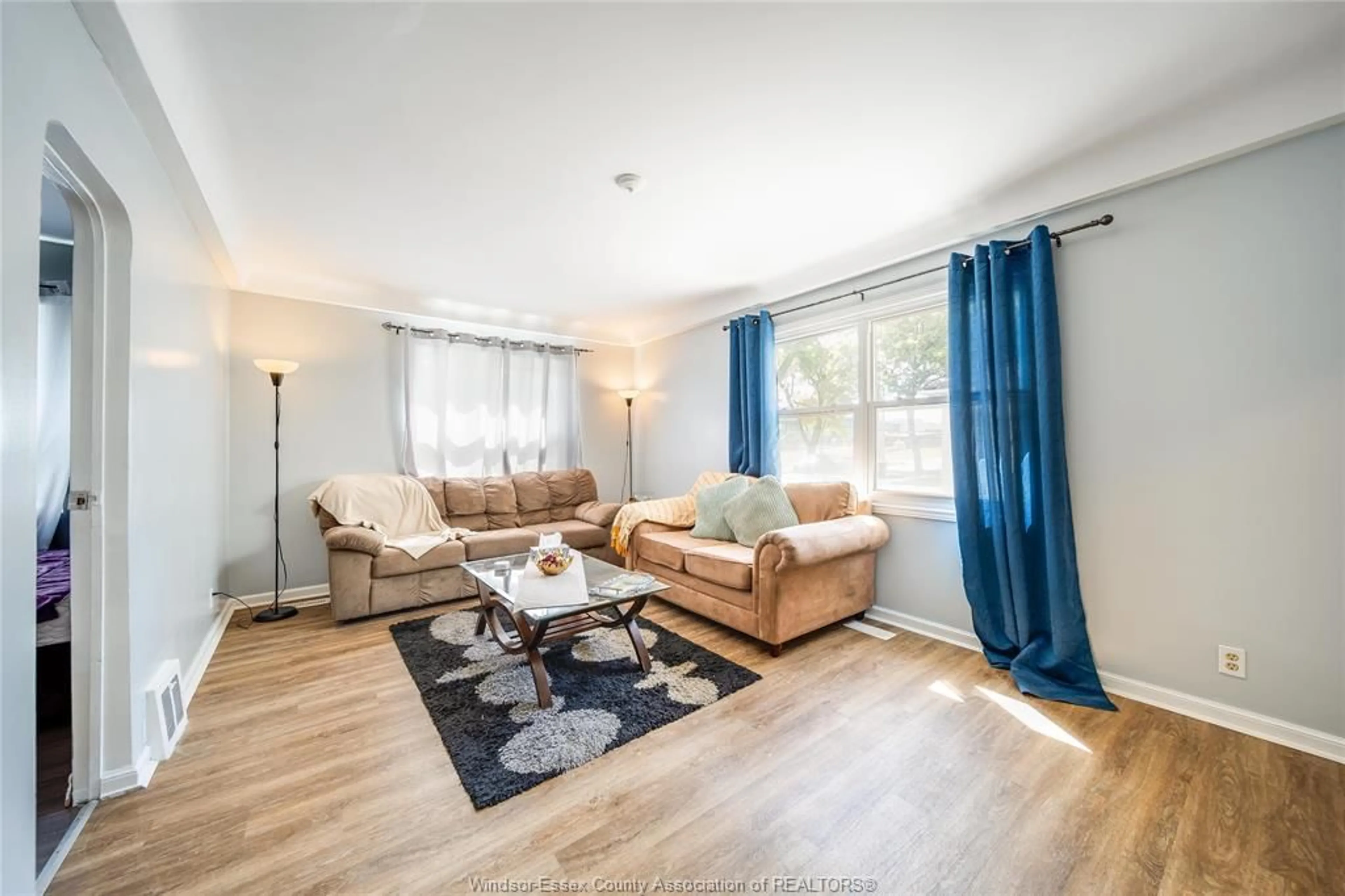 Living room with furniture, wood/laminate floor for 473 INDIAN Rd, Windsor Ontario N9C 2M3