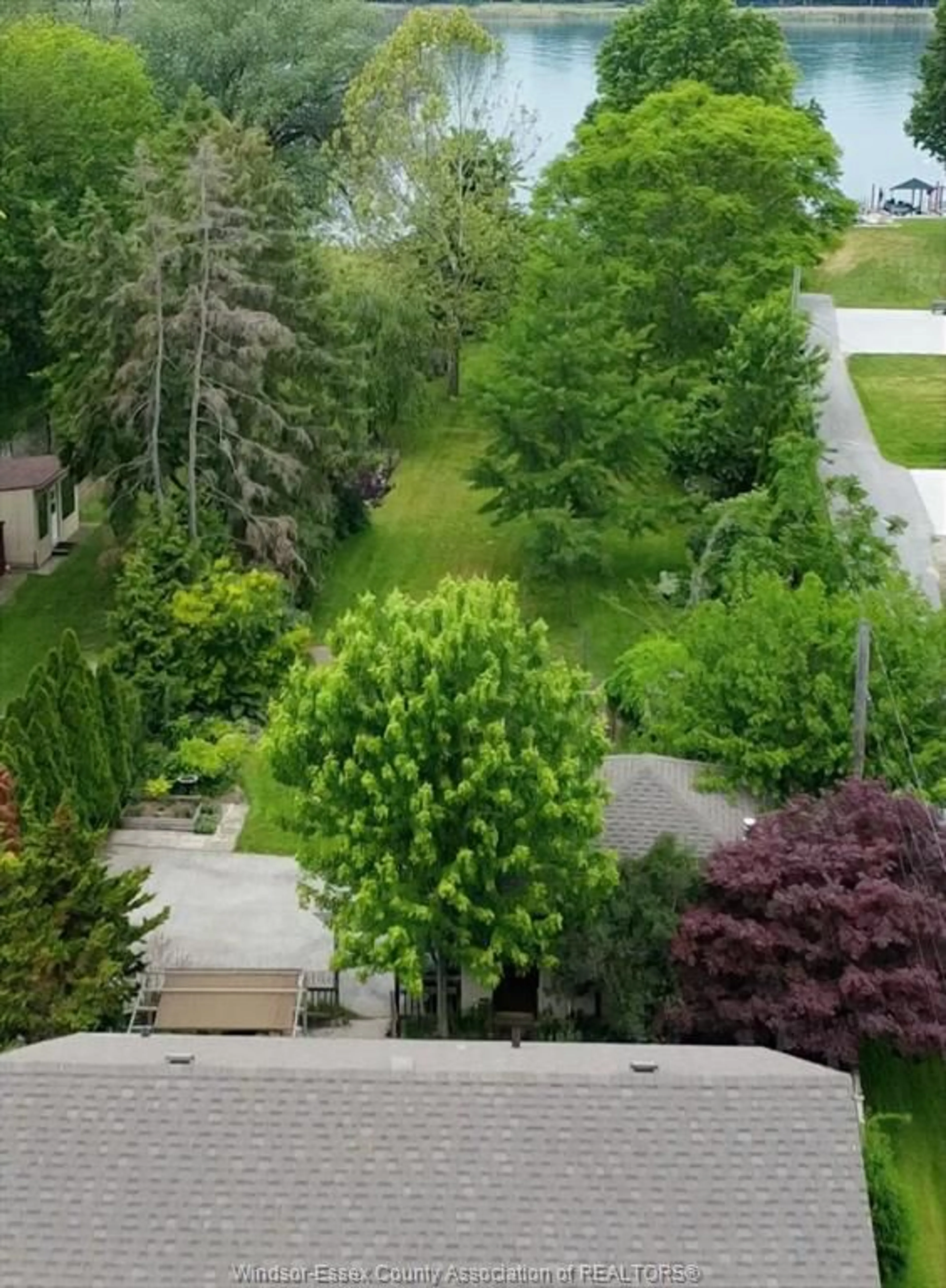 A pic from outside/outdoor area/front of a property/back of a property/a pic from drone, forest/trees view for 1610 Front Rd, LaSalle Ontario N9J 2B6