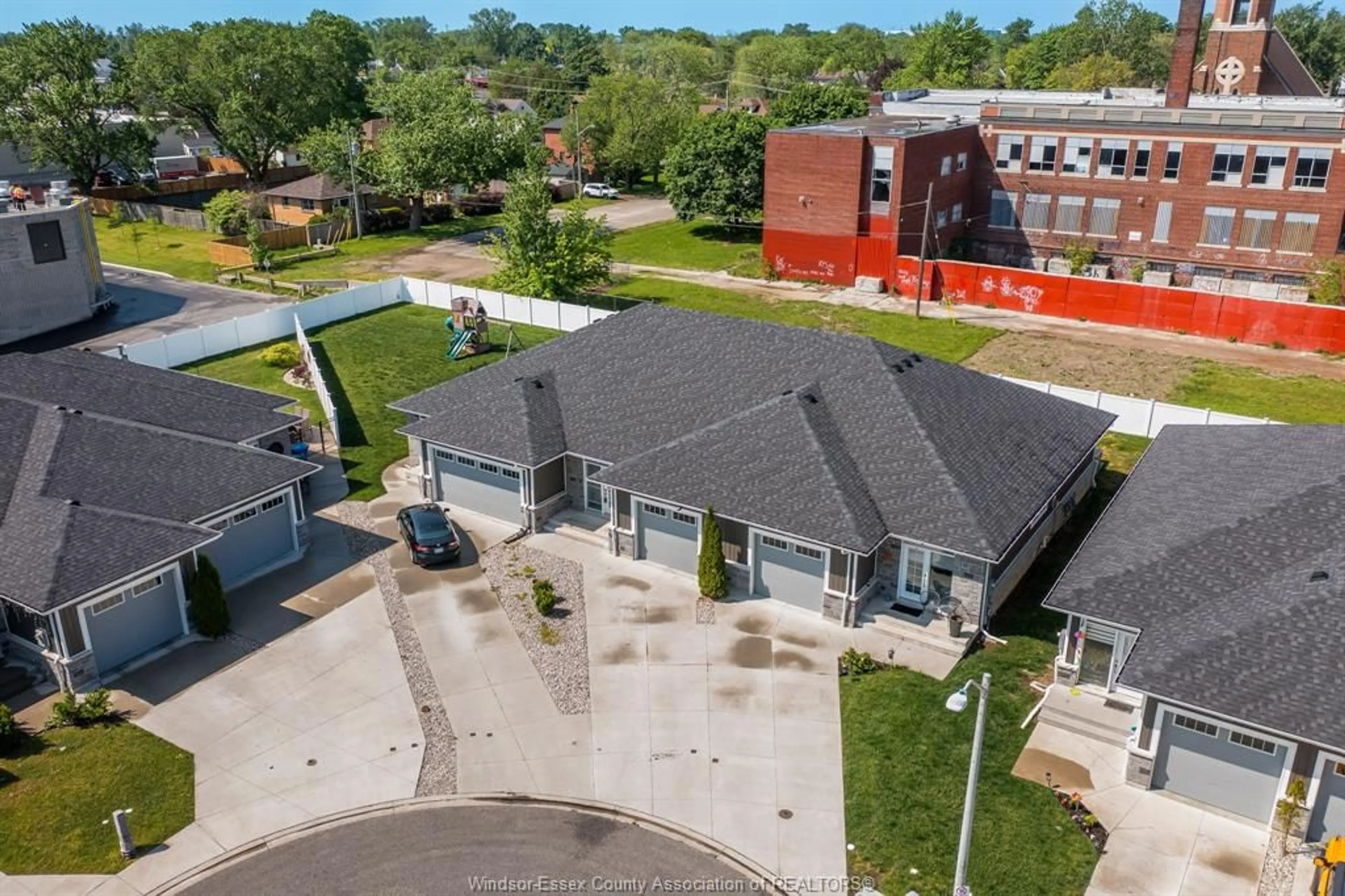 A pic from outside/outdoor area/front of a property/back of a property/a pic from drone, street for 1985 ETHAN Crt, Windsor Ontario N8T 1G1
