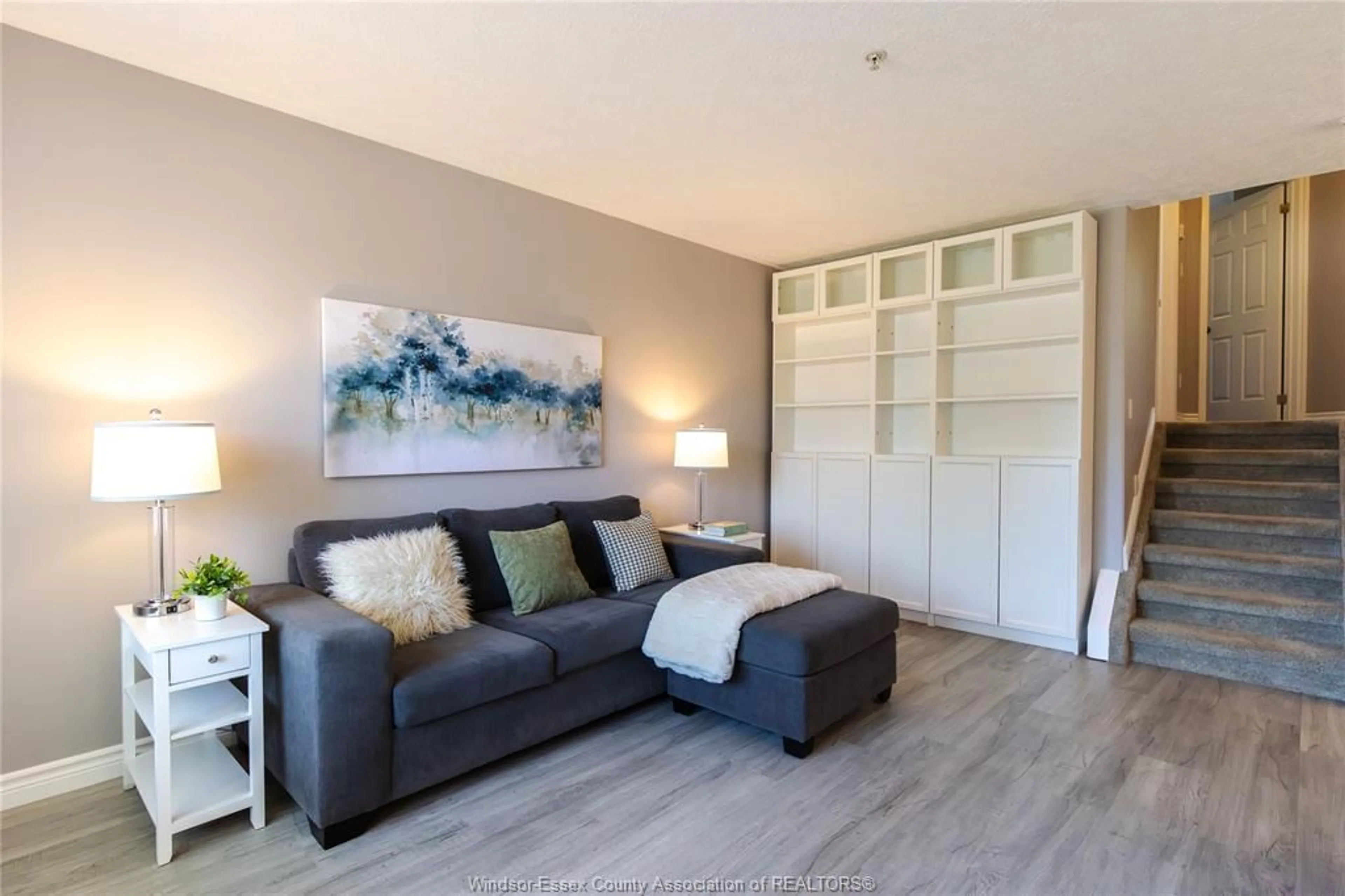 Living room with furniture, wood/laminate floor for 3994 MAPLE LEAF, Windsor Ontario N8W 5R3