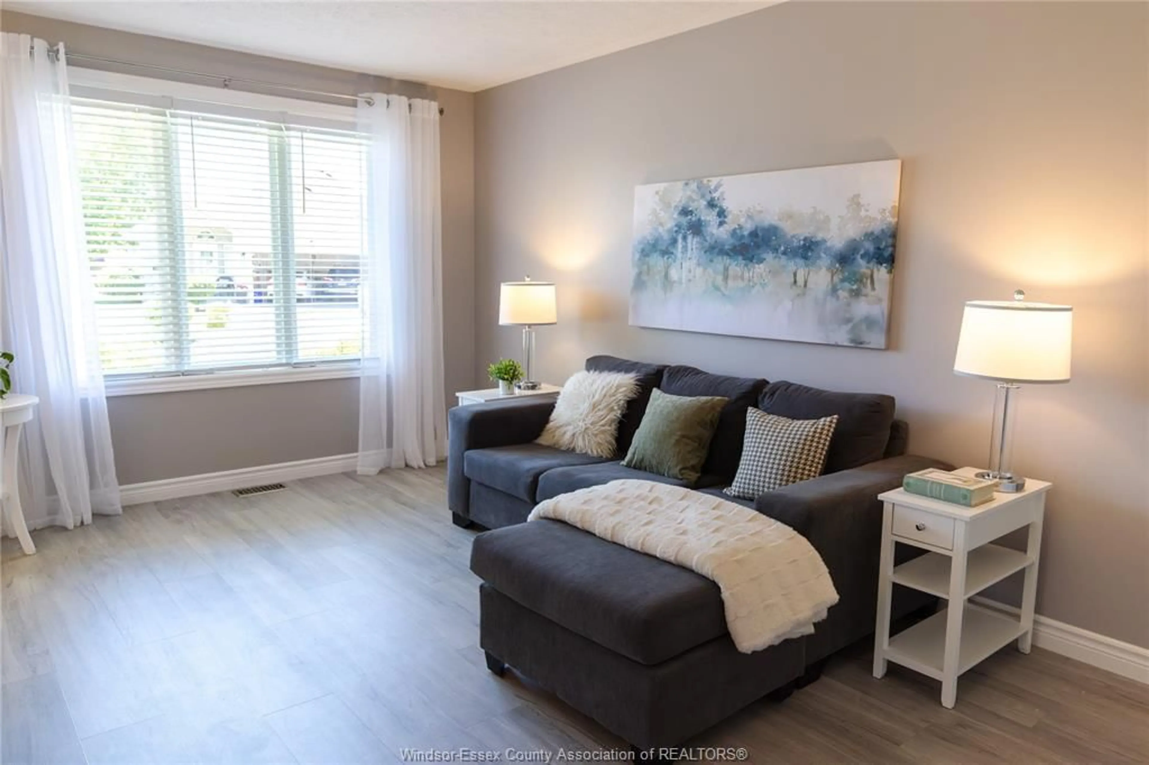 Living room with furniture, wood/laminate floor for 3994 MAPLE LEAF, Windsor Ontario N8W 5R3