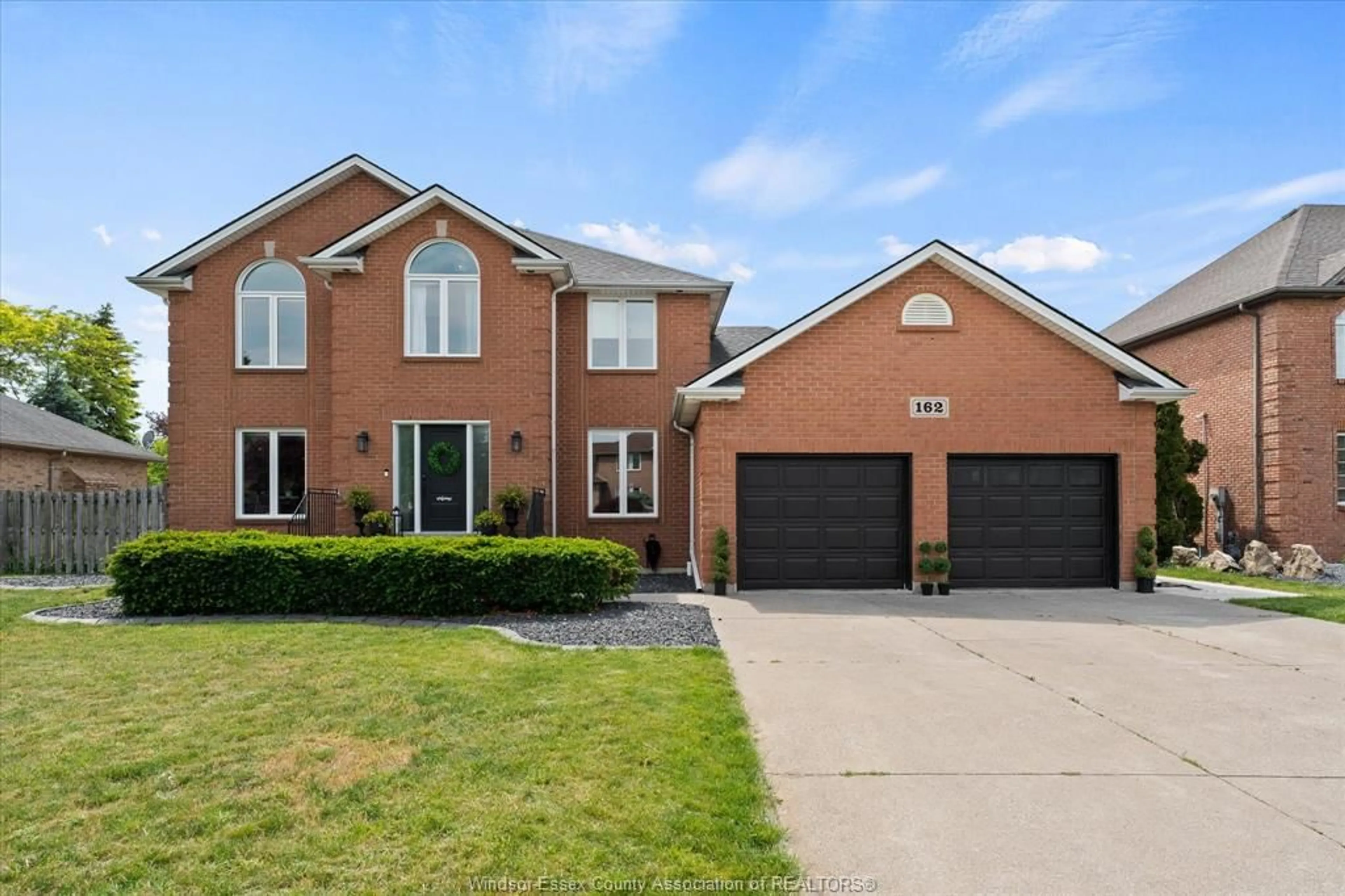 Home with brick exterior material, street for 162 MARTIN Dr, Lakeshore Ontario N8L 0Z6
