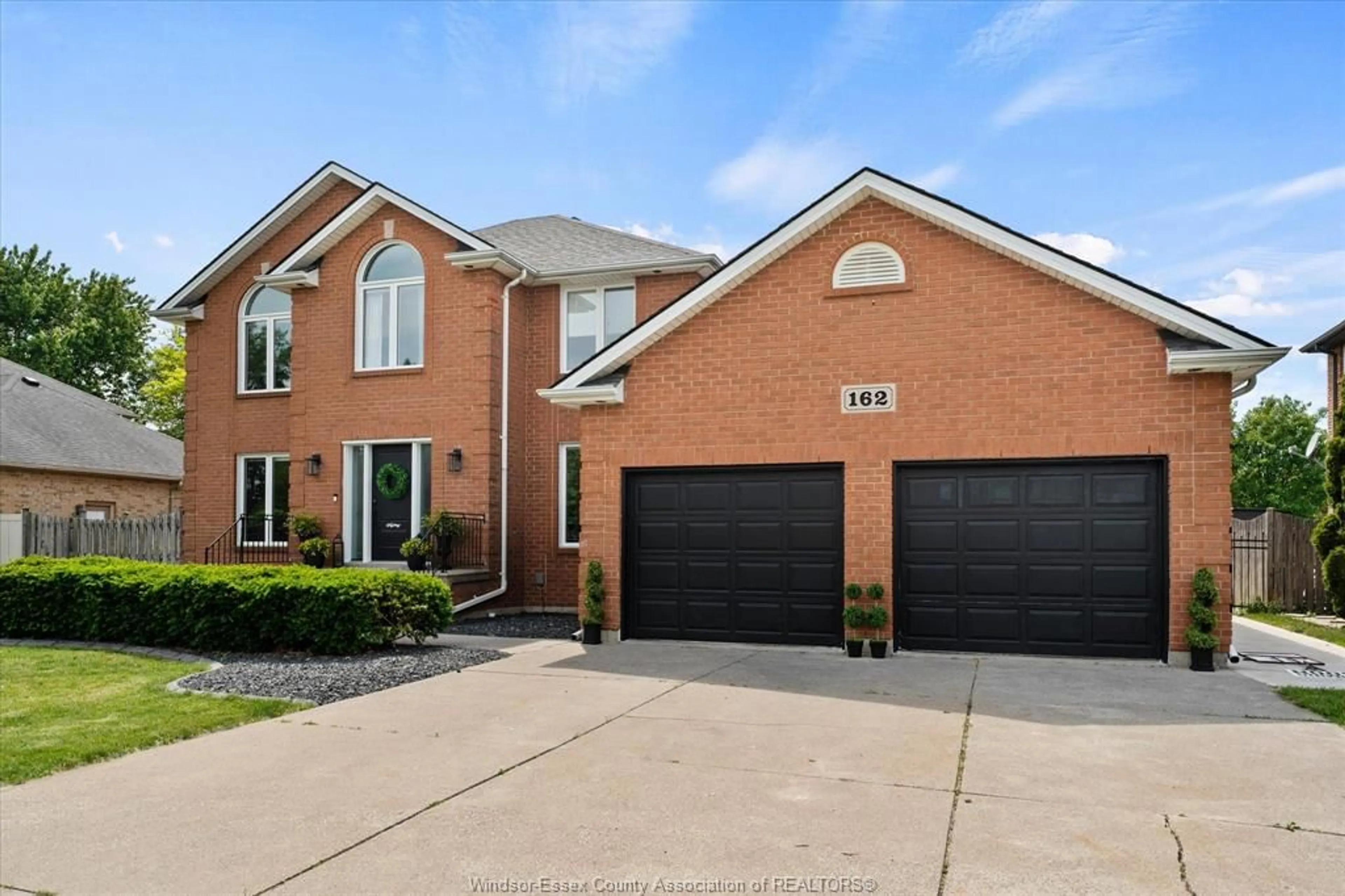 Home with brick exterior material, street for 162 MARTIN Dr, Lakeshore Ontario N8L 0Z6
