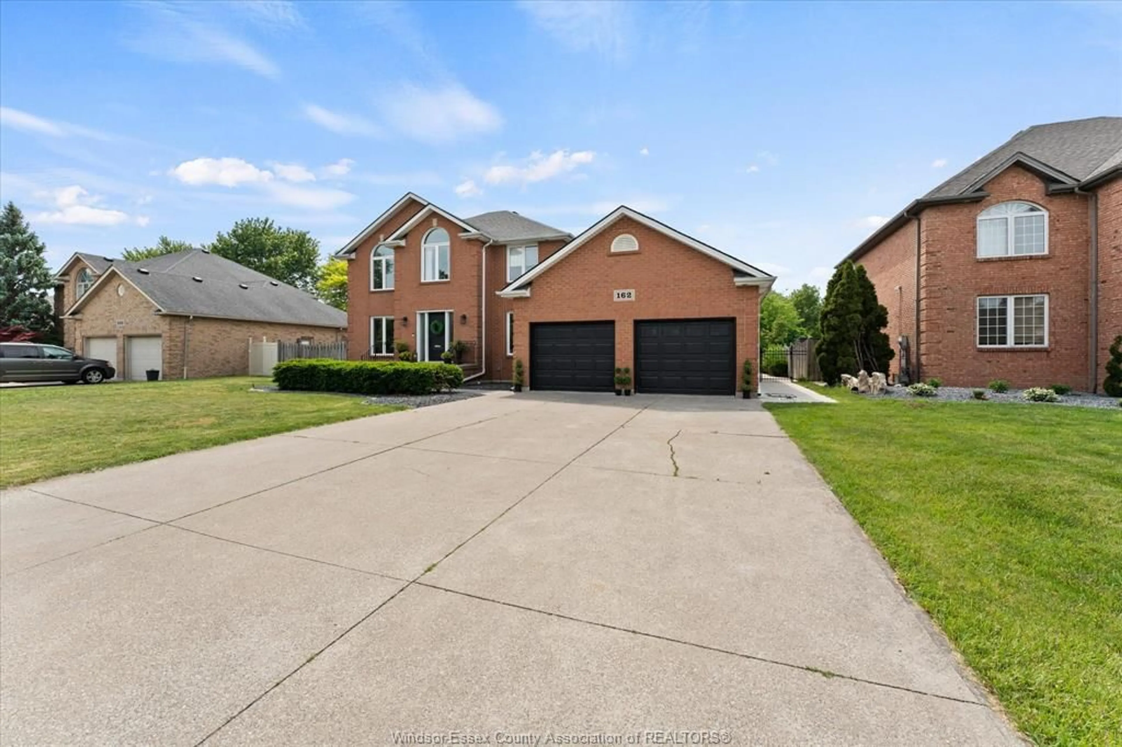 Home with brick exterior material, street for 162 MARTIN Dr, Lakeshore Ontario N8L 0Z6
