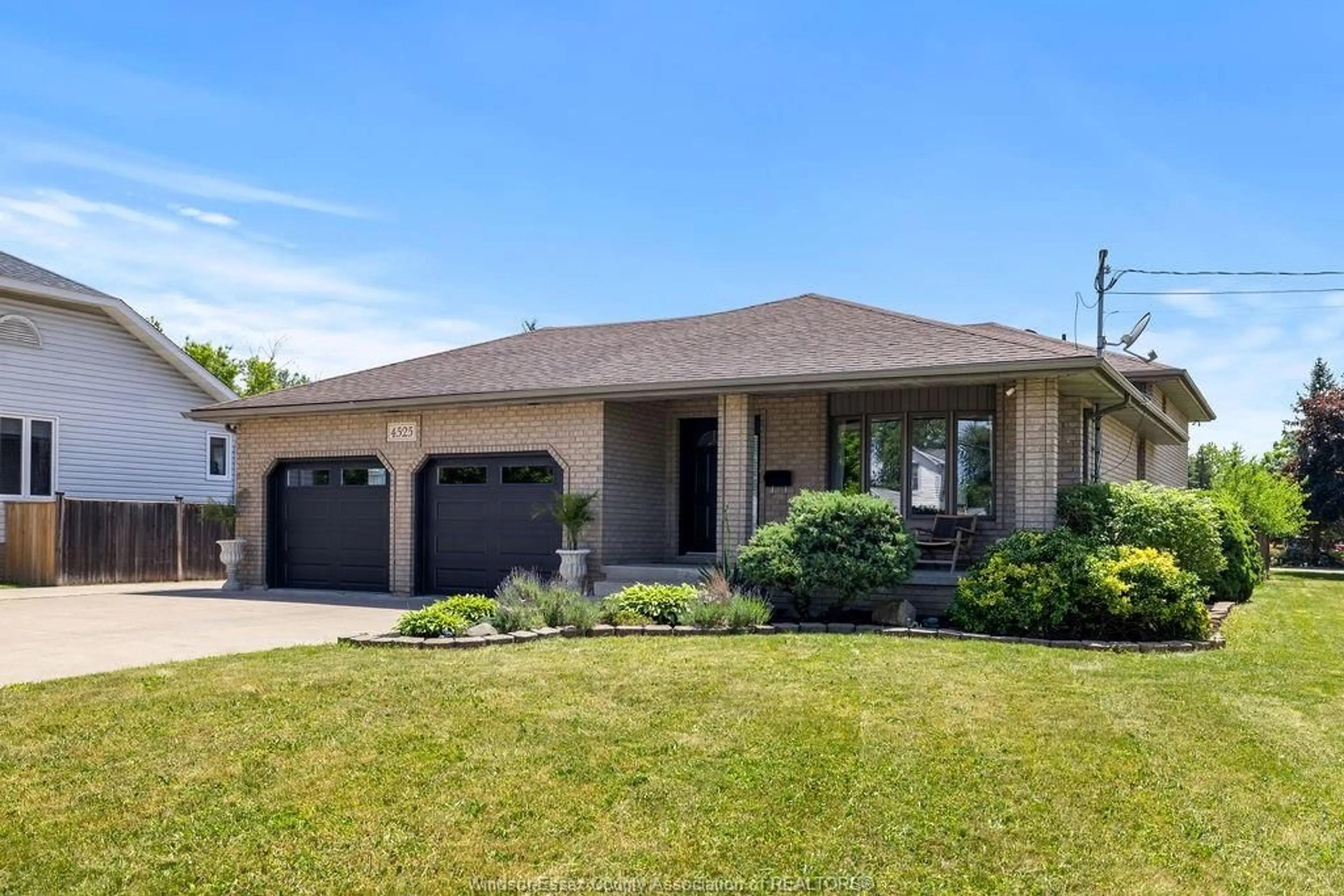 Home with brick exterior material, street for 4525 GRAND MARAIS RD E, Windsor Ontario N8W 1X5