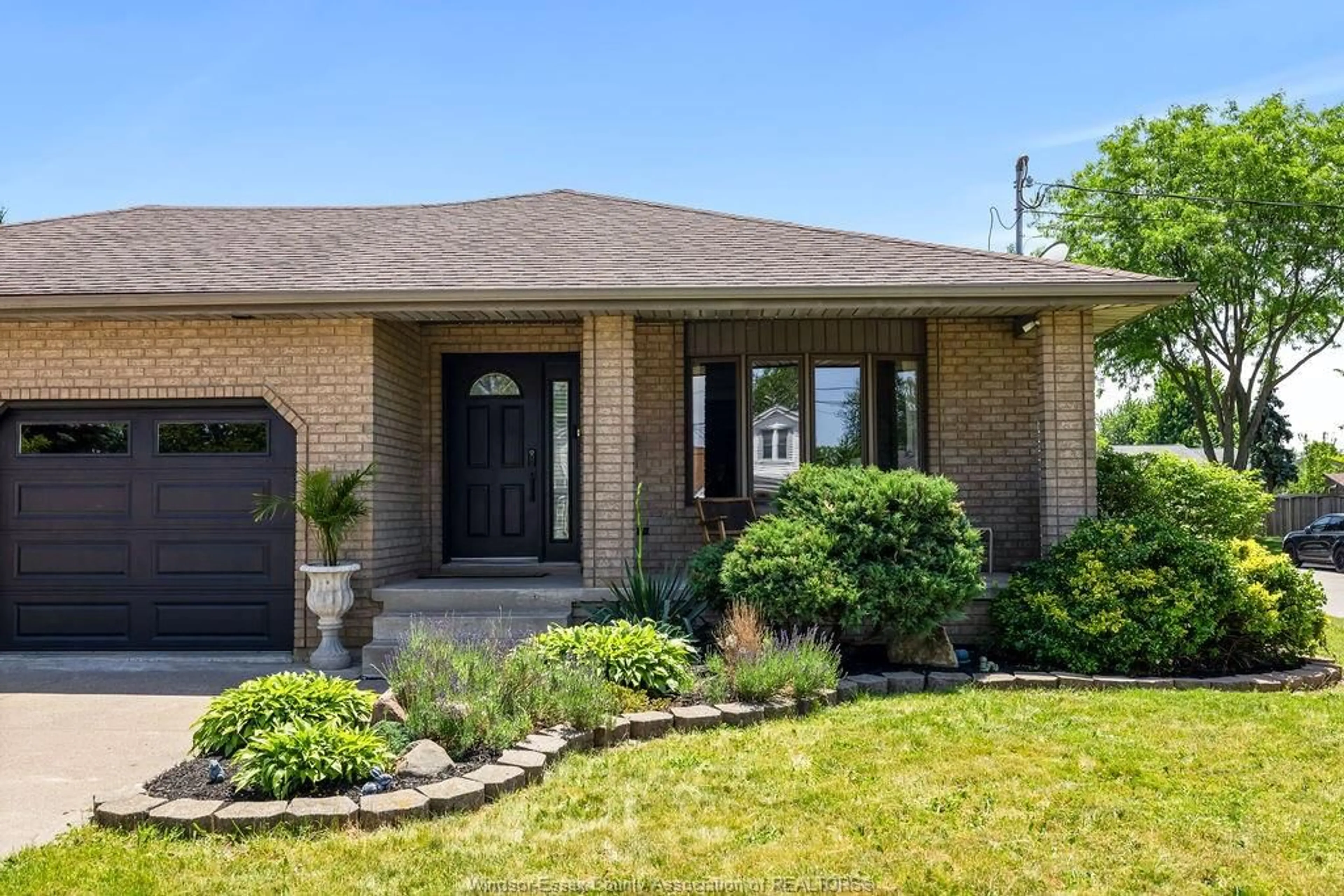 Home with brick exterior material, street for 4525 GRAND MARAIS RD E, Windsor Ontario N8W 1X5