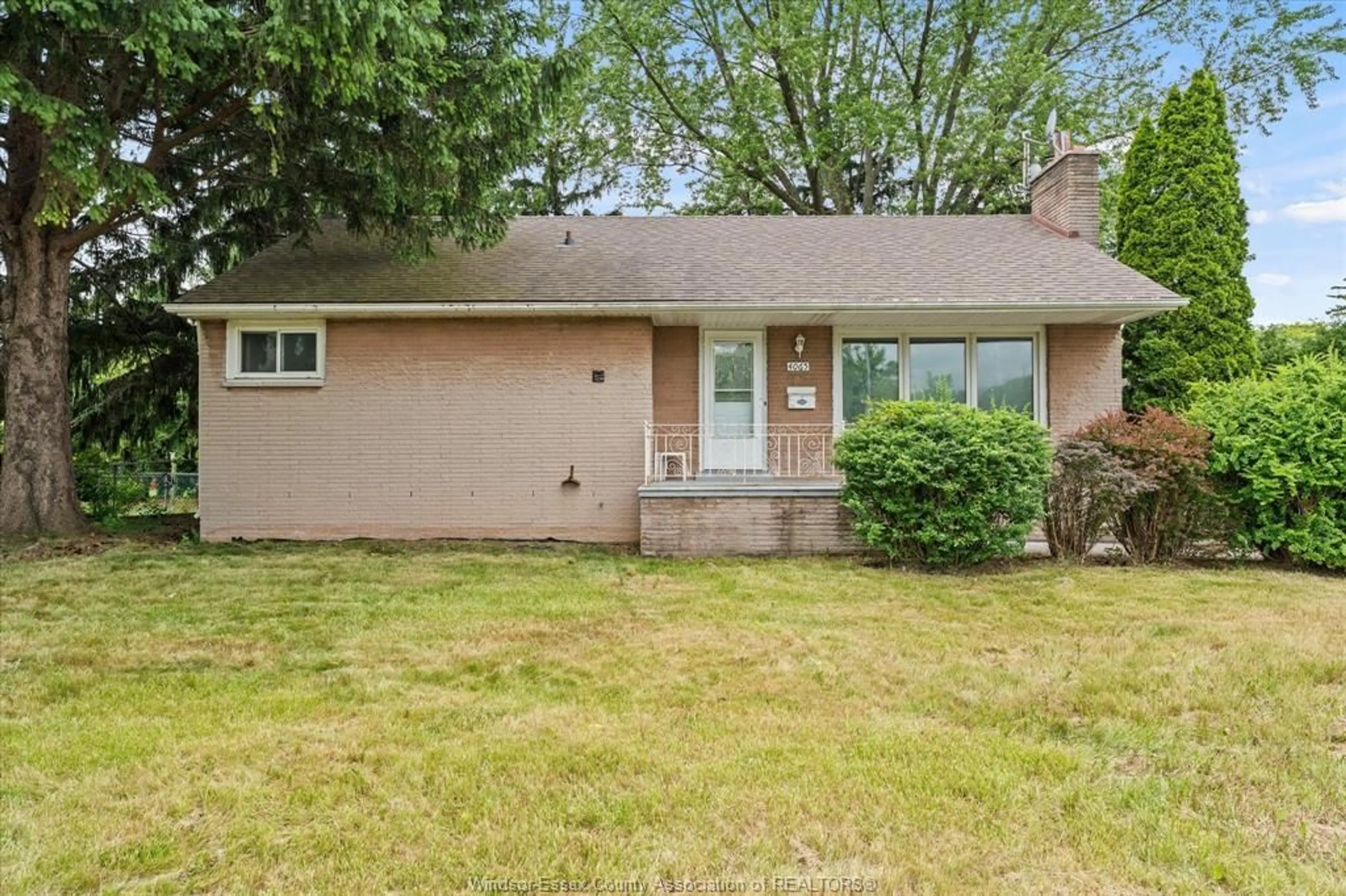 Home with vinyl exterior material, street for 4065 Dougall, Windsor Ontario N9G 1X4