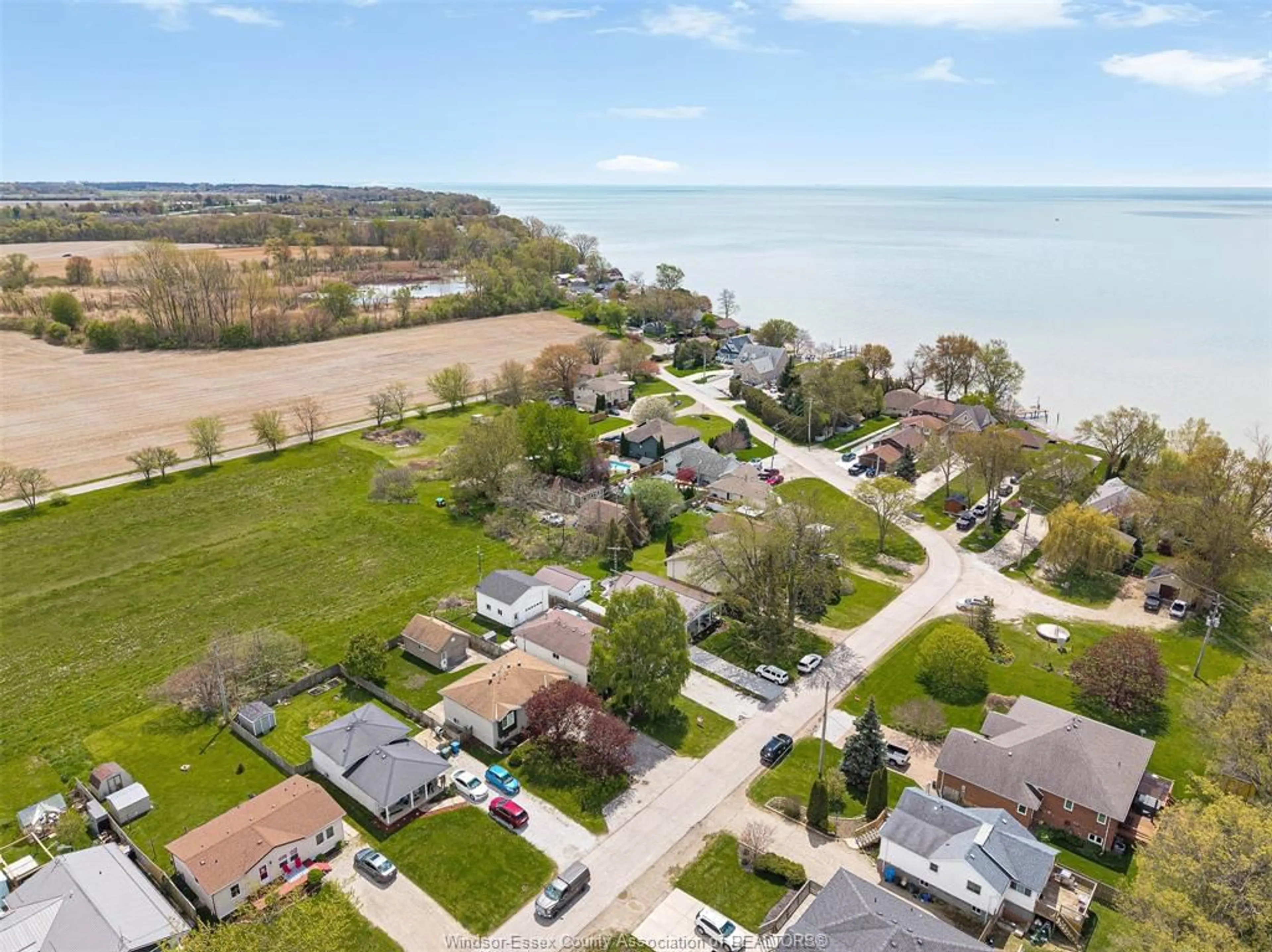 A pic from outside/outdoor area/front of a property/back of a property/a pic from drone, water/lake/river/ocean view for 114 GLOUCESTER Dr, Colchester Ontario N0R 1G0