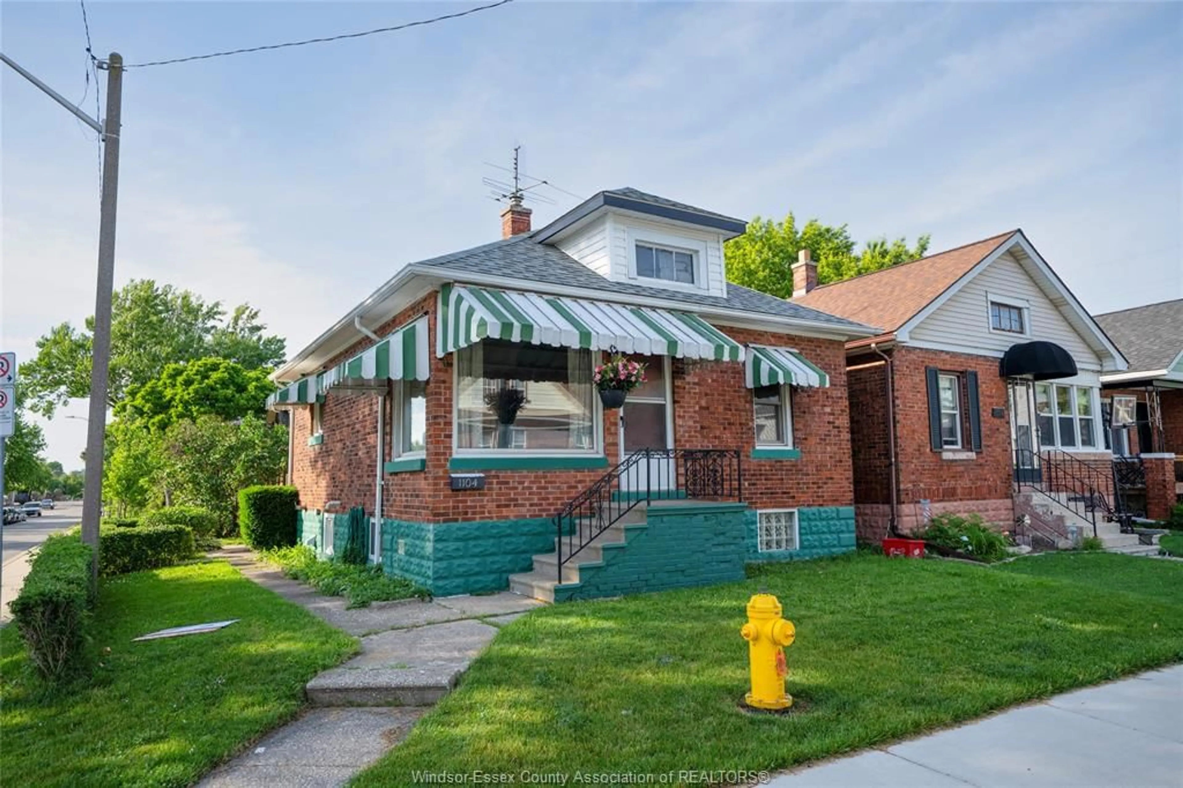 Home with brick exterior material, street for 1104 Ellis St E, Windsor Ontario N8X 2J3