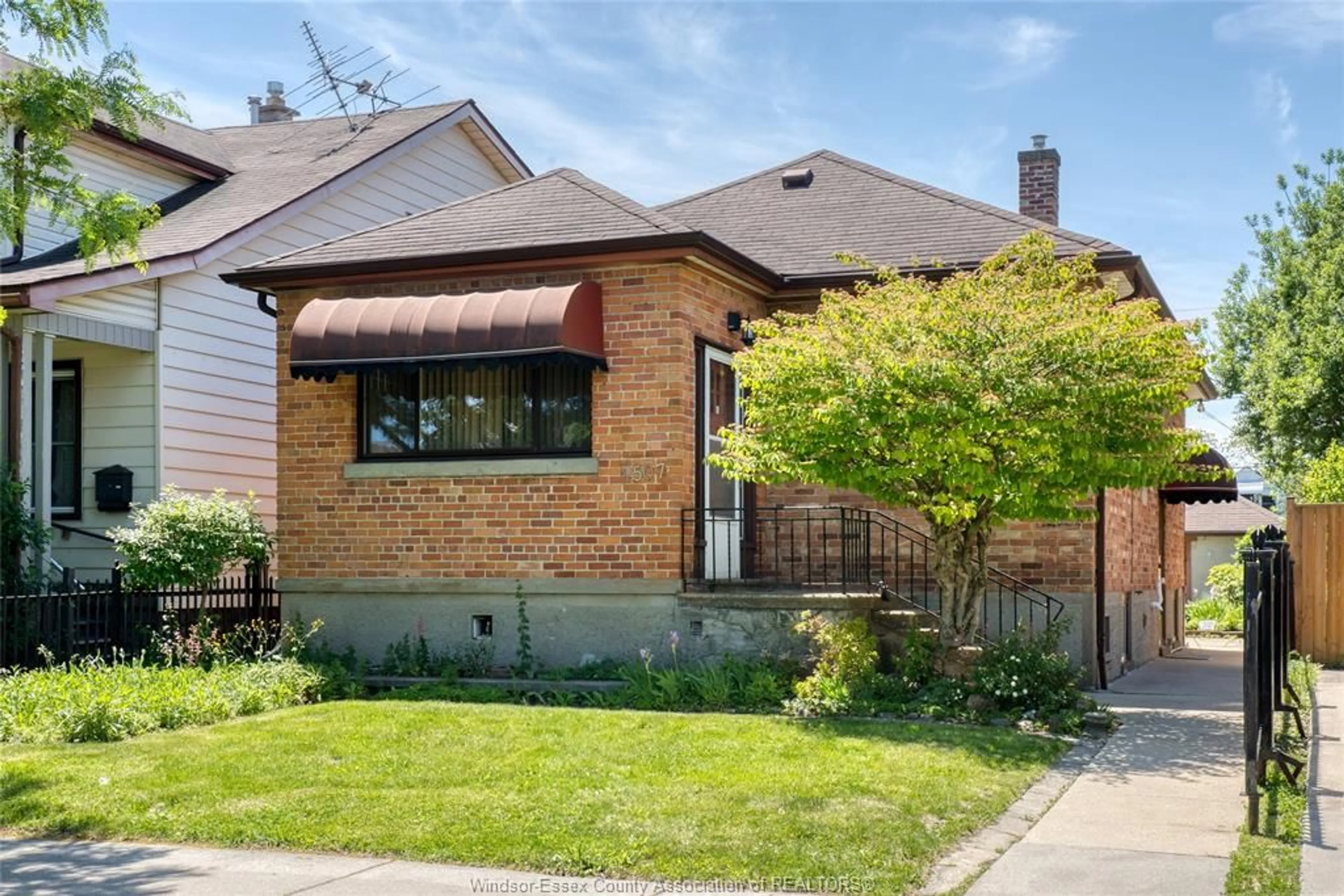Home with brick exterior material, street for 1507 LANGLOIS, Windsor Ontario N8X 4M3
