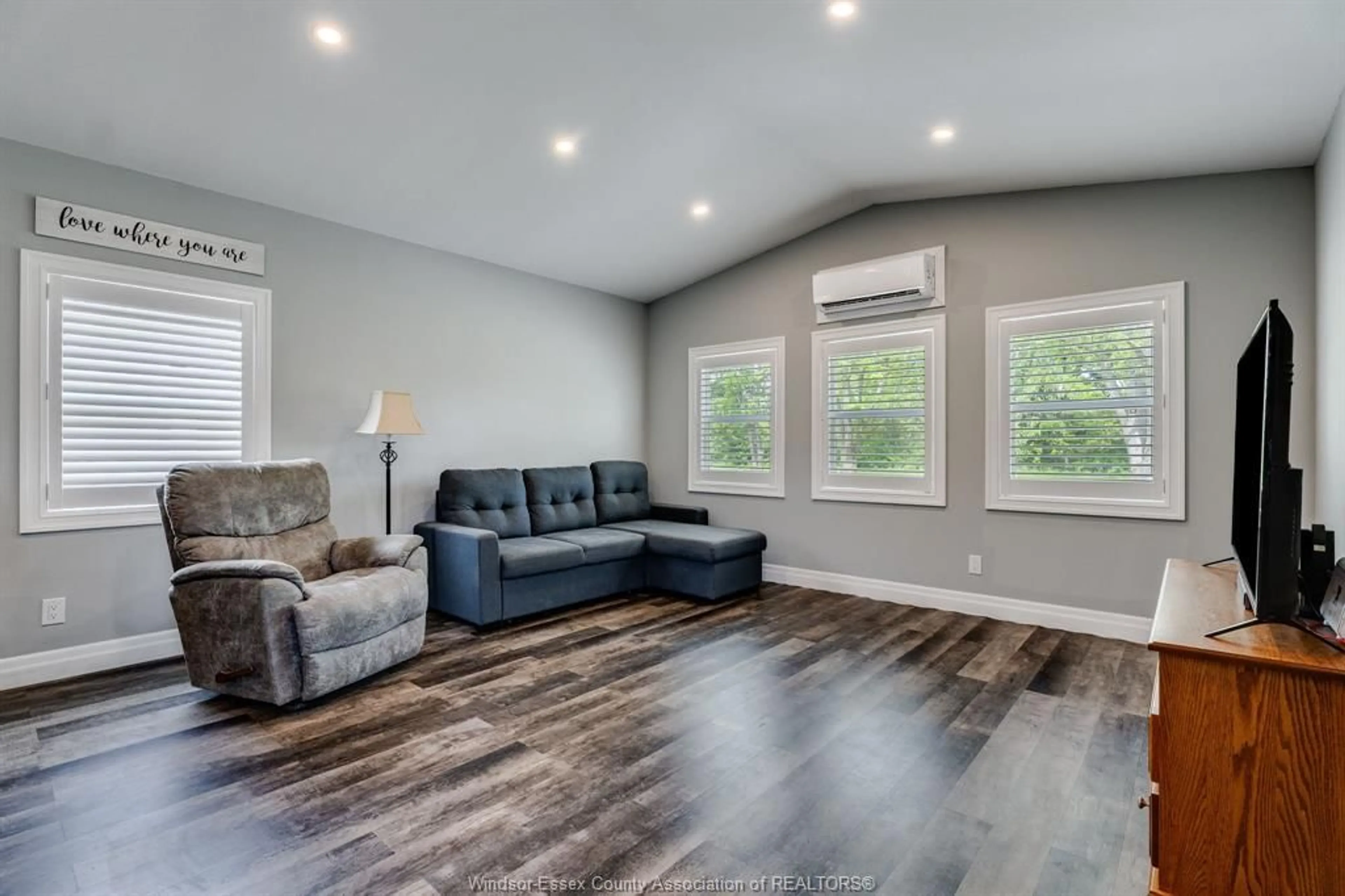 Living room with furniture, wood/laminate floor for 11408 County Rd 46 #10, Comber Ontario N0P 1J0