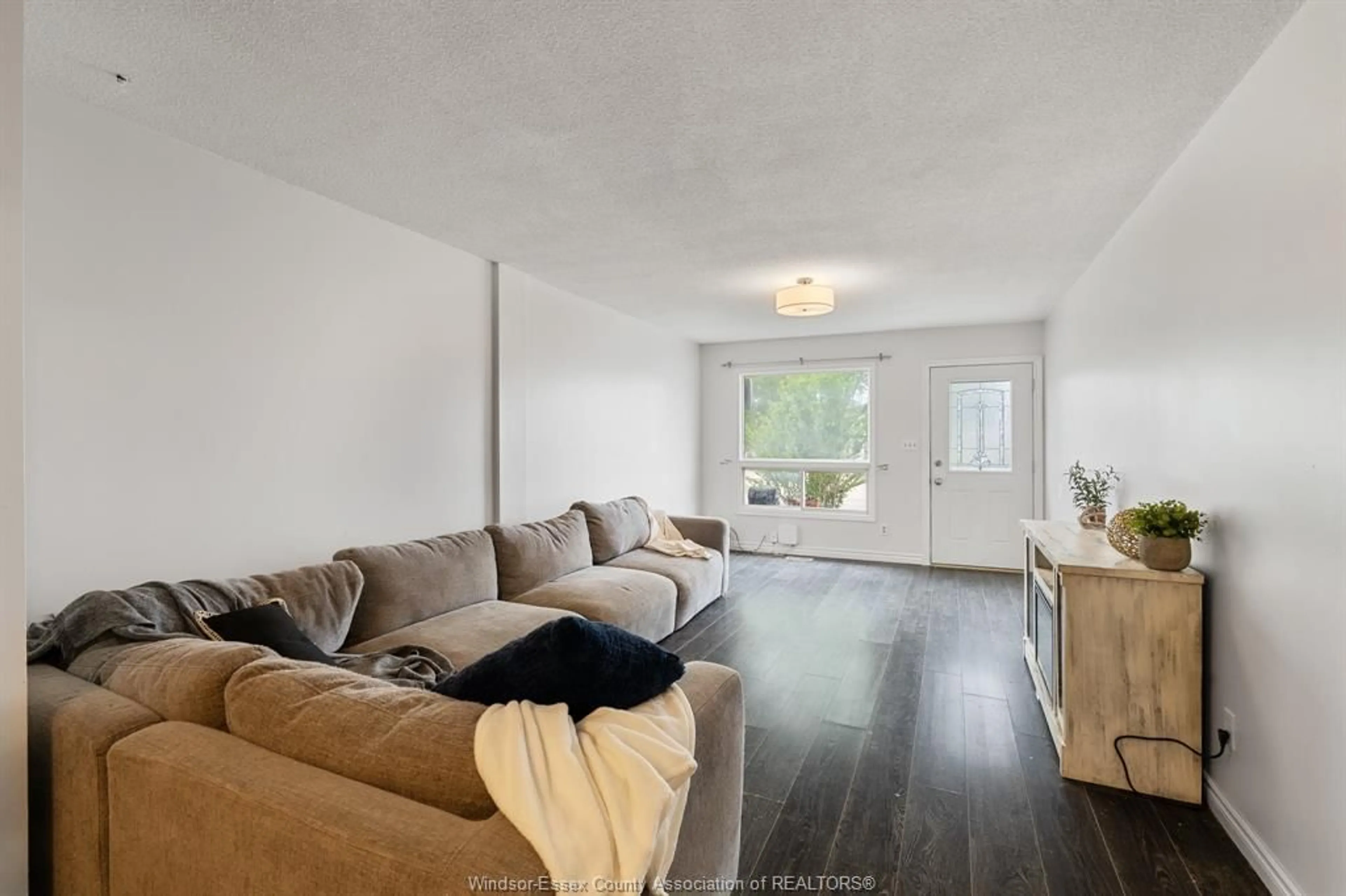 Living room with furniture, unknown for 85 Satinwood Cres, Leamington Ontario N8H 4P1