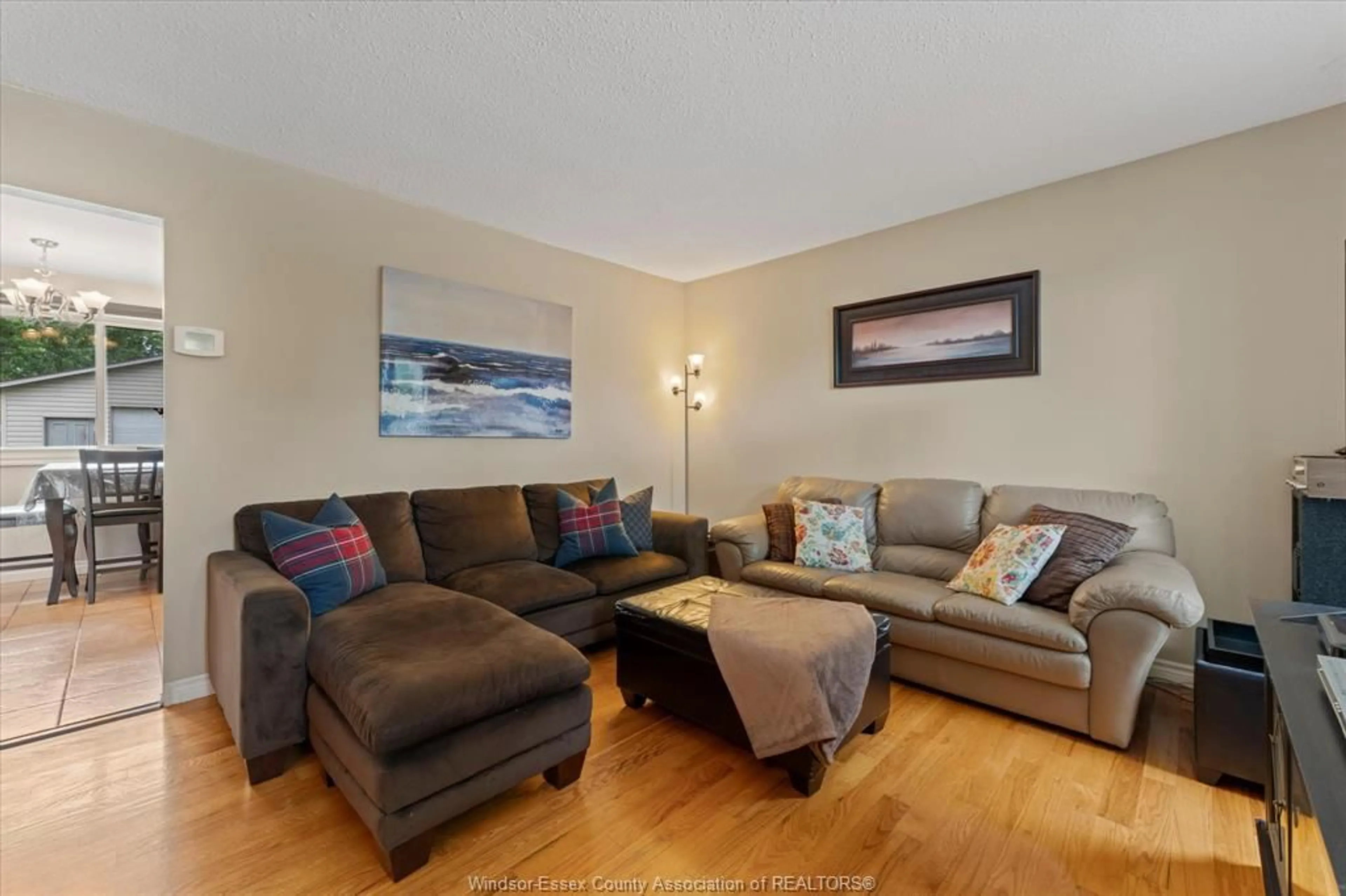 Living room with furniture, wood/laminate floor for 3285 ROSEBRIAR Rd, Windsor Ontario N8R 1Y2
