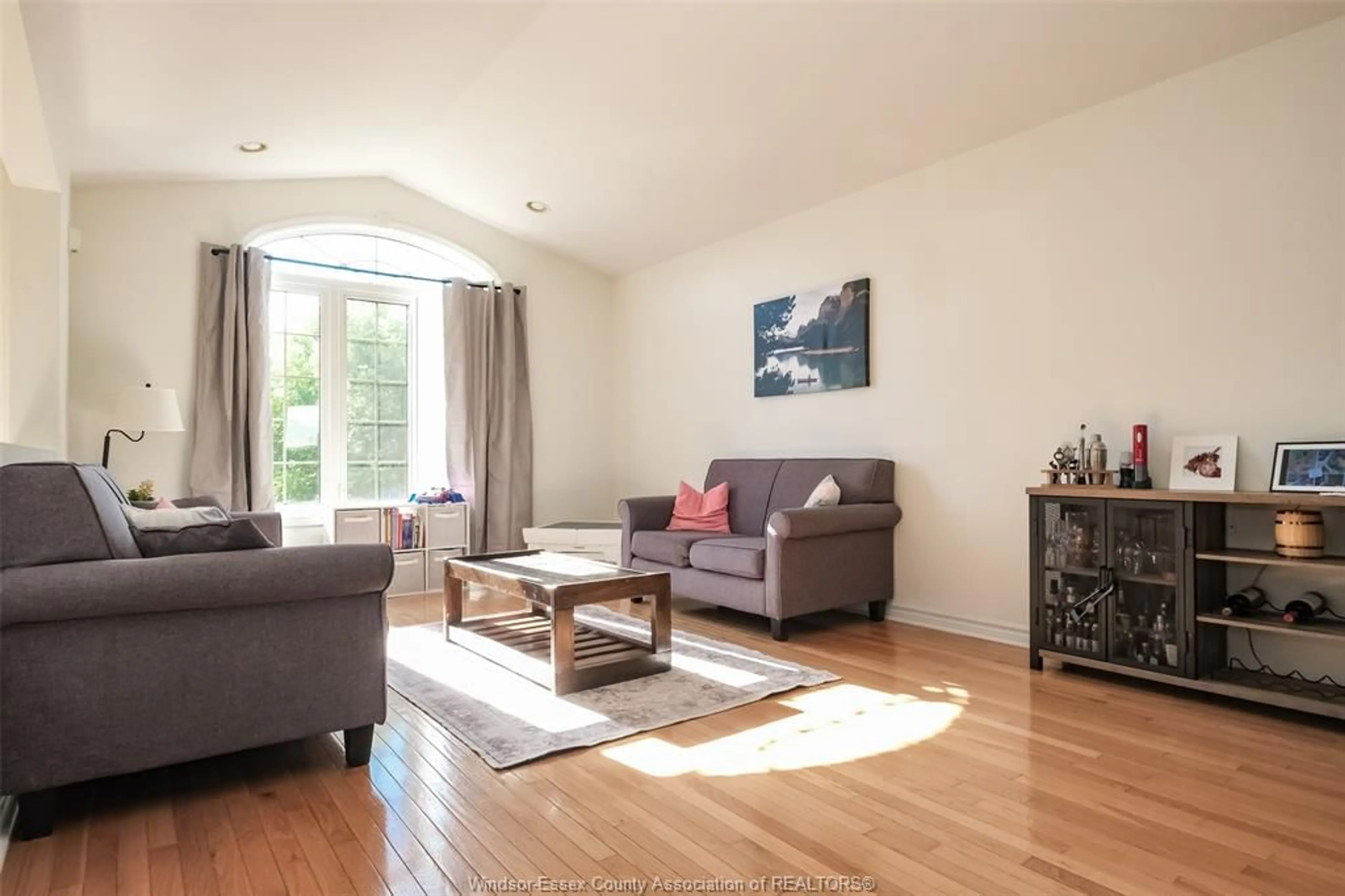 Living room with furniture, wood/laminate floor for 838 SOUTHWOOD Dr, Lakeshore Ontario N8L 1G1