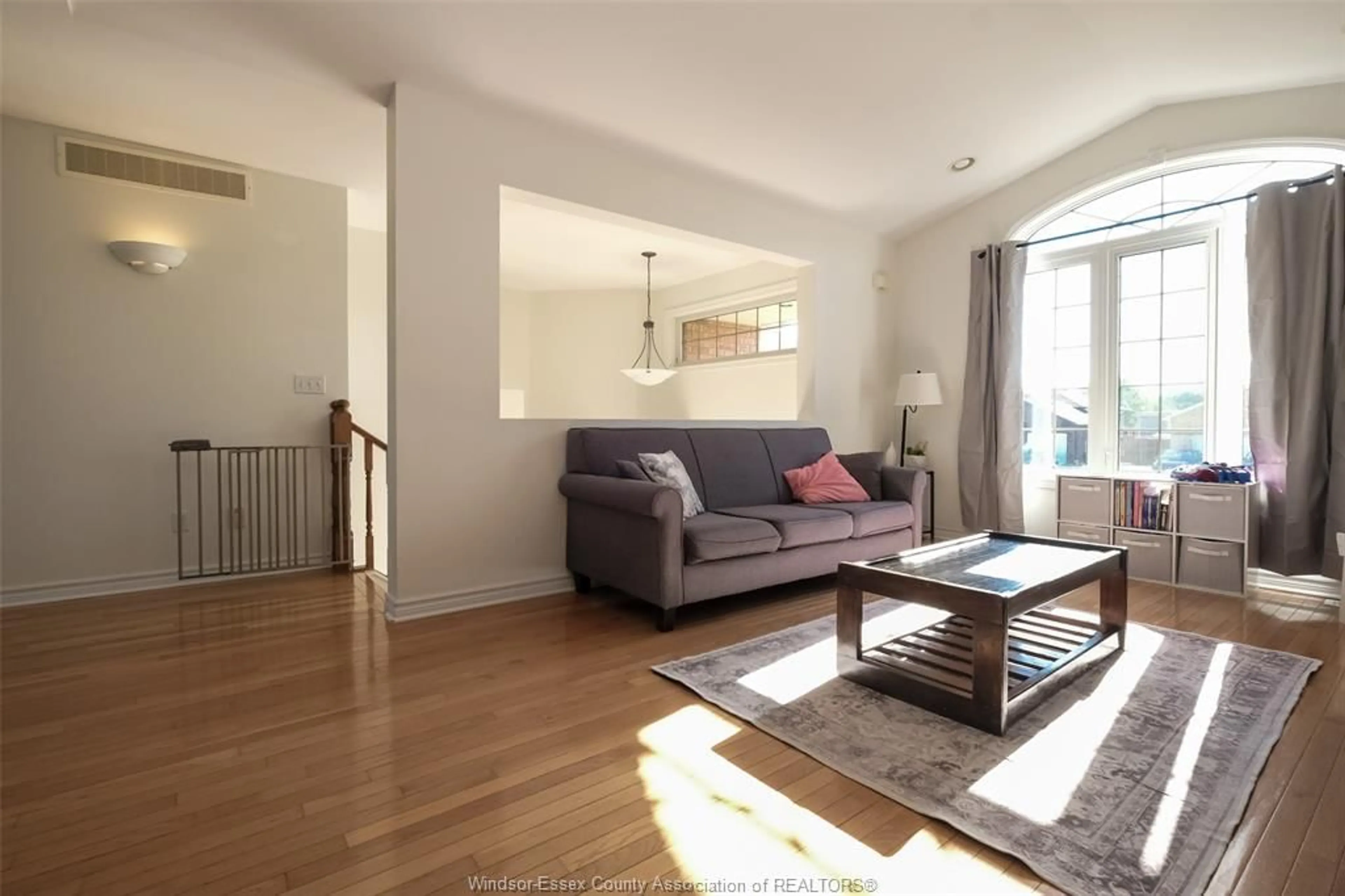 Living room with furniture, wood/laminate floor for 838 SOUTHWOOD Dr, Lakeshore Ontario N8L 1G1