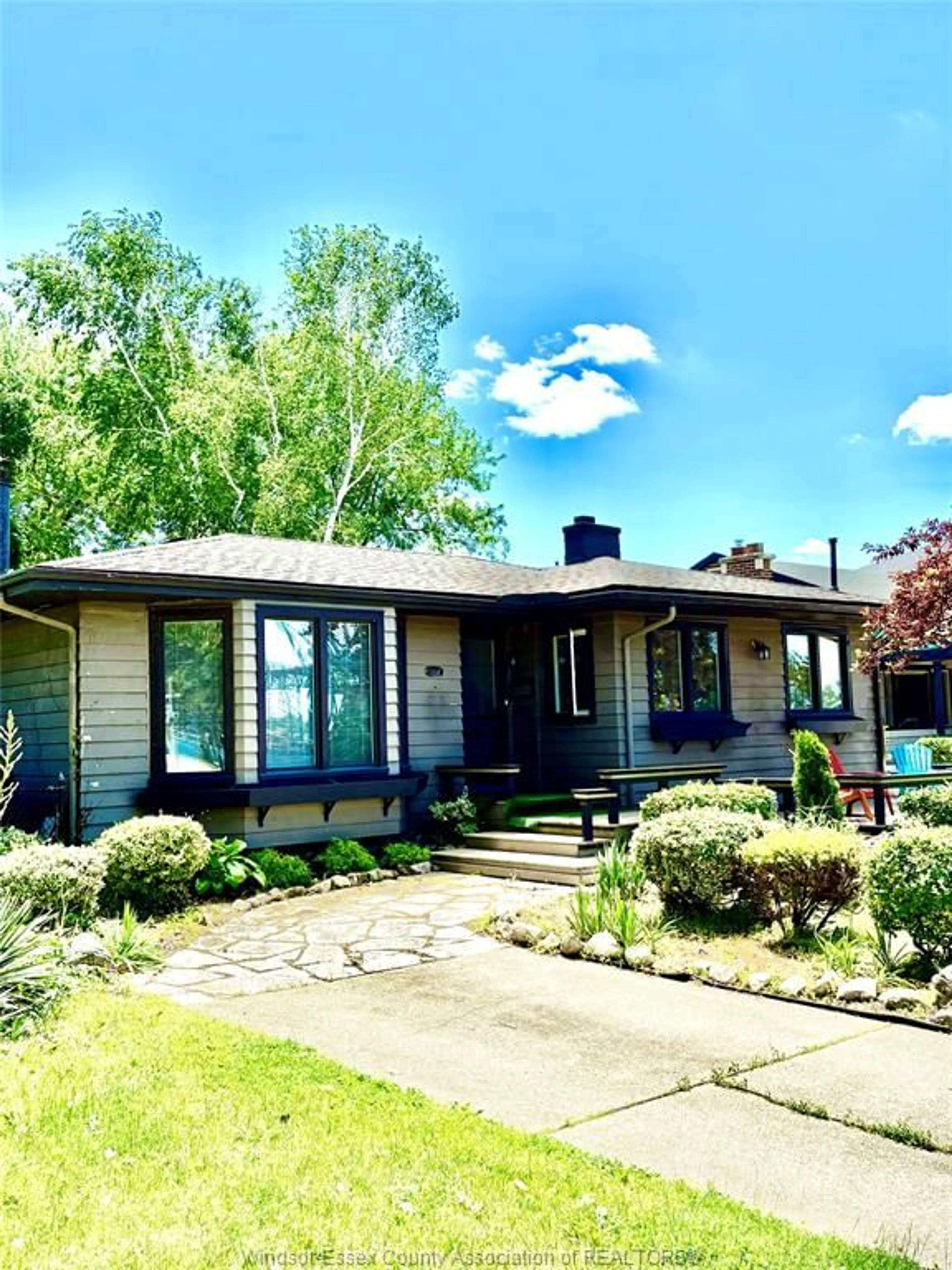 Home with vinyl exterior material, street for 2437 RIVERSIDE Dr, Windsor Ontario N9B 1B2
