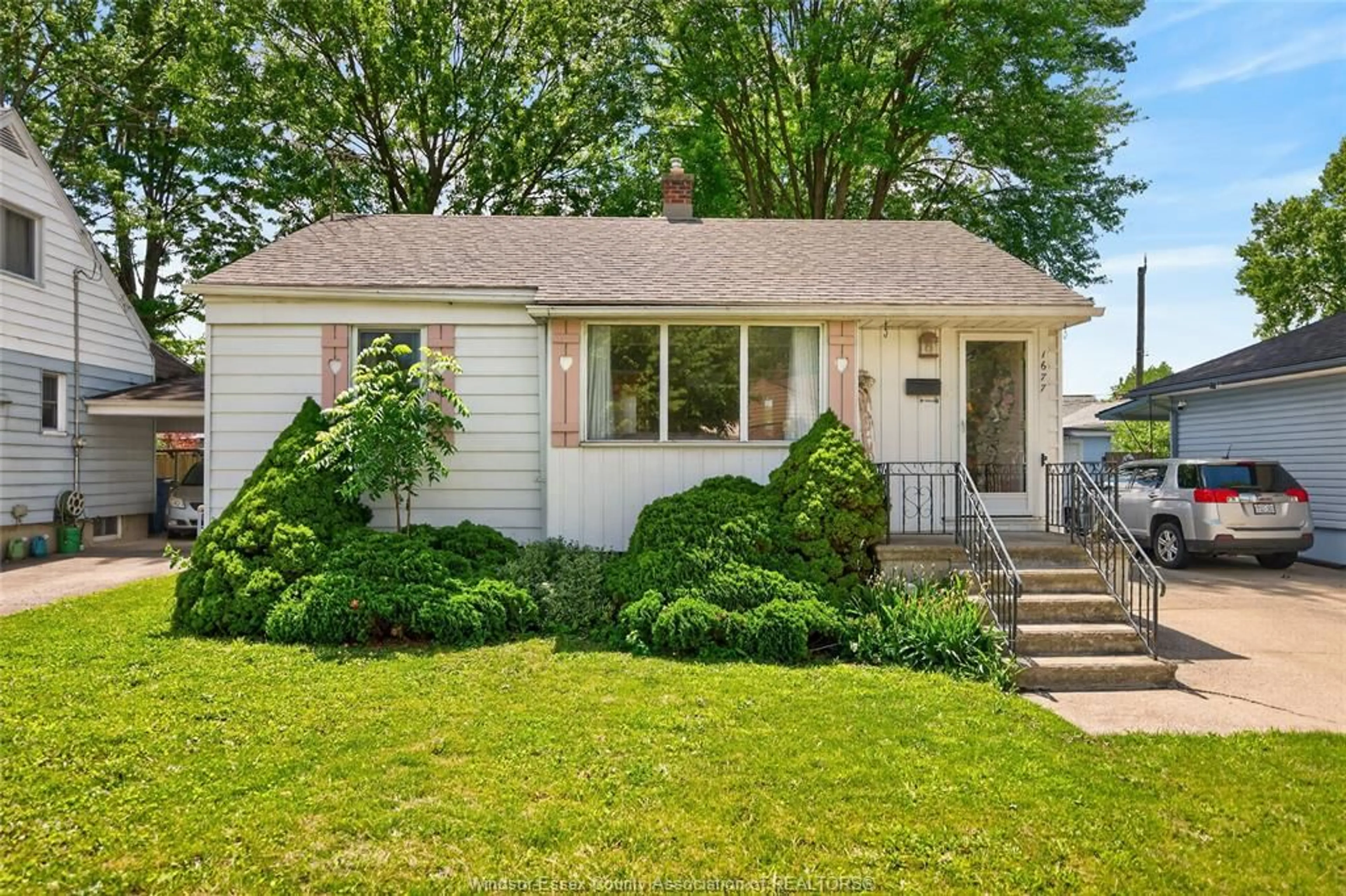 Home with vinyl exterior material, street for 1677 Norman Rd, Windsor Ontario N8Y 4N6